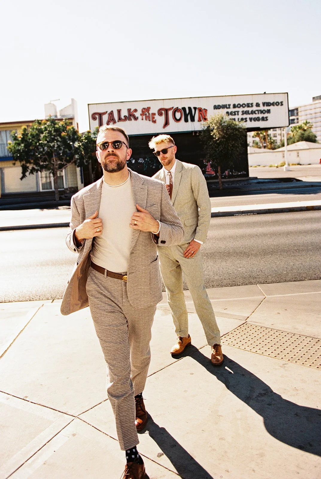 Man strutting in front of the camera during his 35mm film Las Vegas elopement photos.