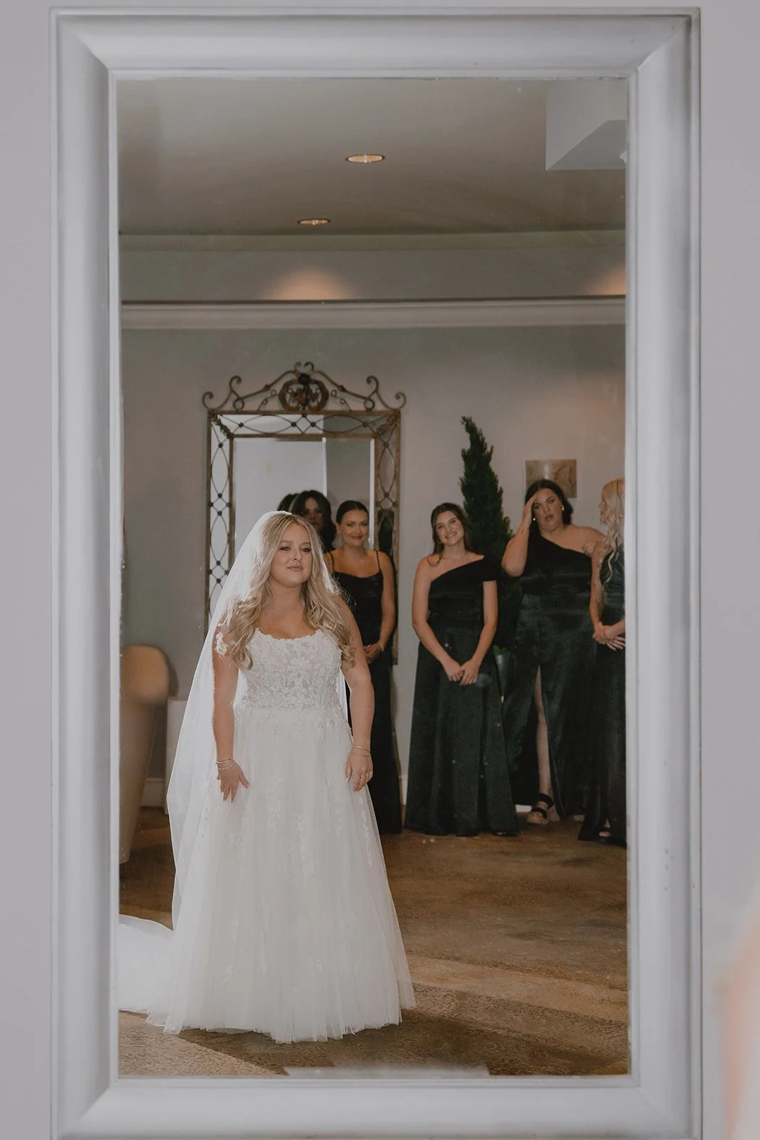 Bride standing in front of her bridesmaids during getting ready for a micro wedding in Las Vegas at Caesars Palace.