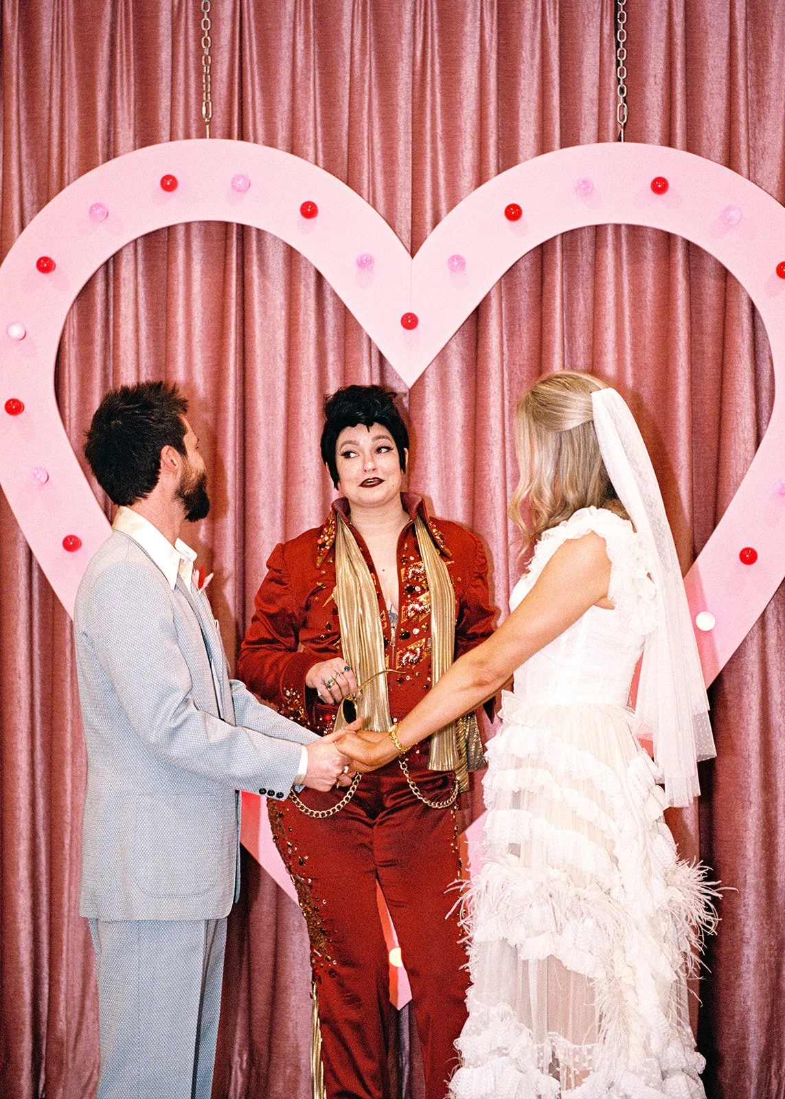 Lady Elvis officiating a wedding ceremony at Sure Thing Chapel in Las Vegas.