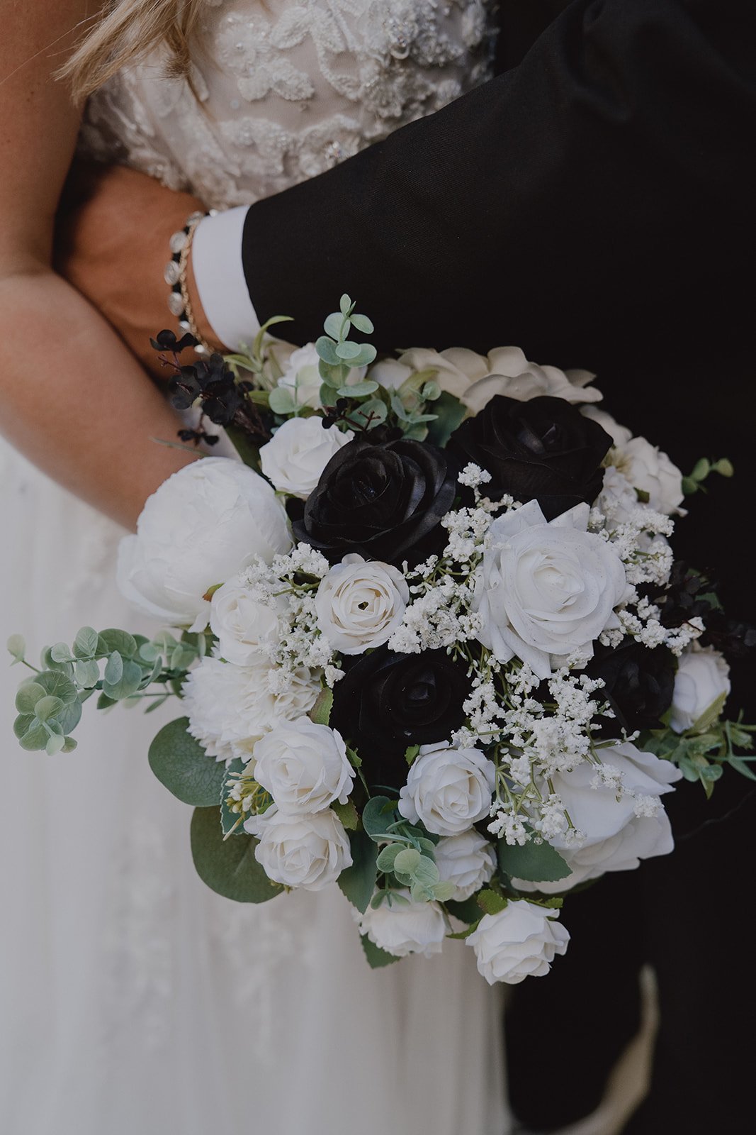 Black and white floral wedding bouquet with roses and greenery during a micro wedding in Las Vegas.