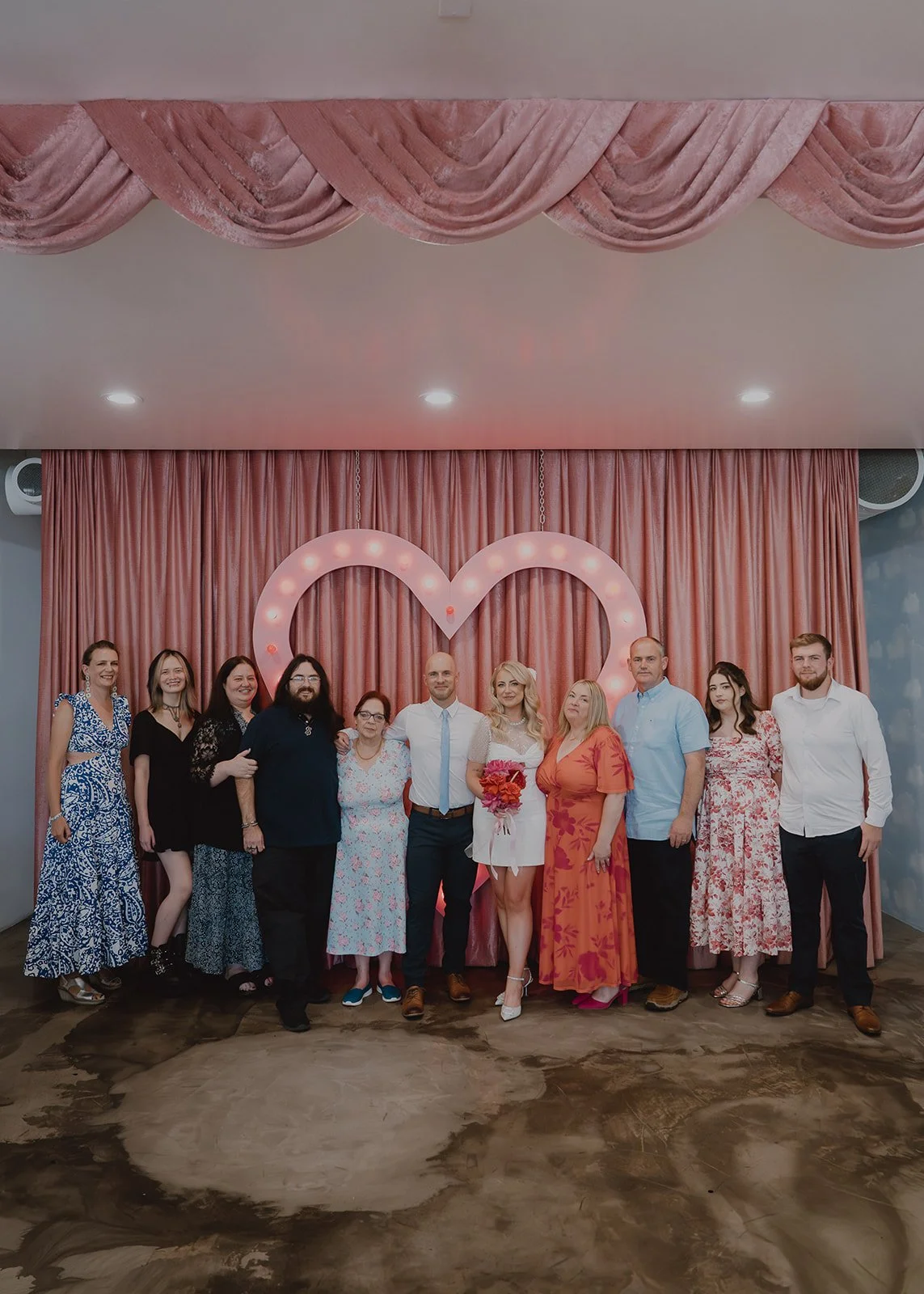 Group family photo at Sure Thing Chapel following a Las Vegas micro wedding ceremony.