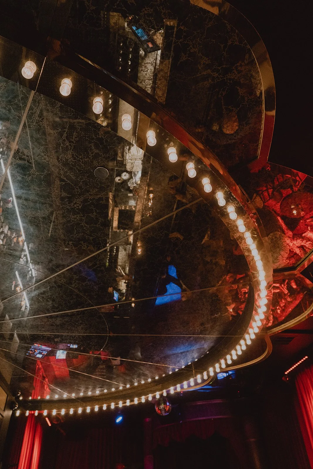 Ceiling mirror and lights inside Cheapshot Las Vegas bar wedding reception space.