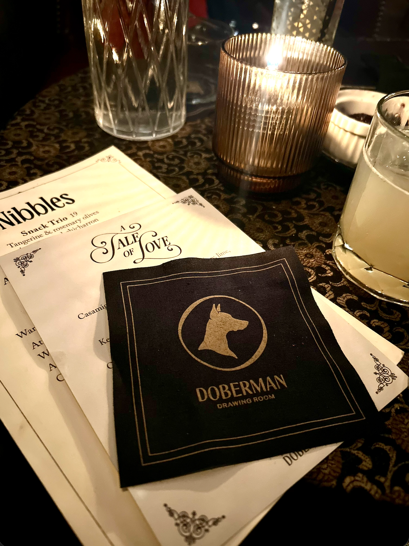 A menu and cocktail napkin from the Doberman Bar and Lounge in Las Vegas