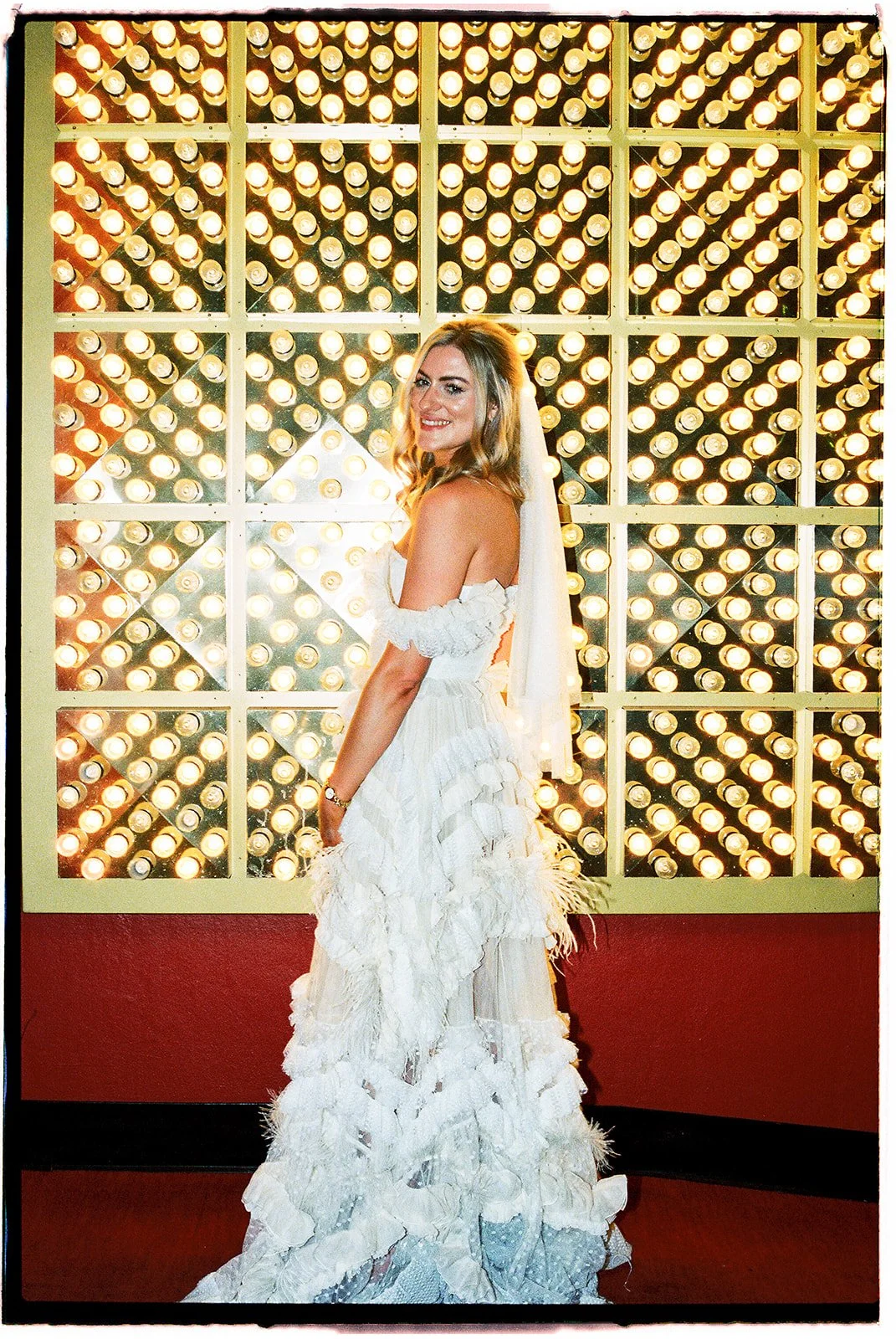 35mm film photo of a bride posing in front of The Plaza.