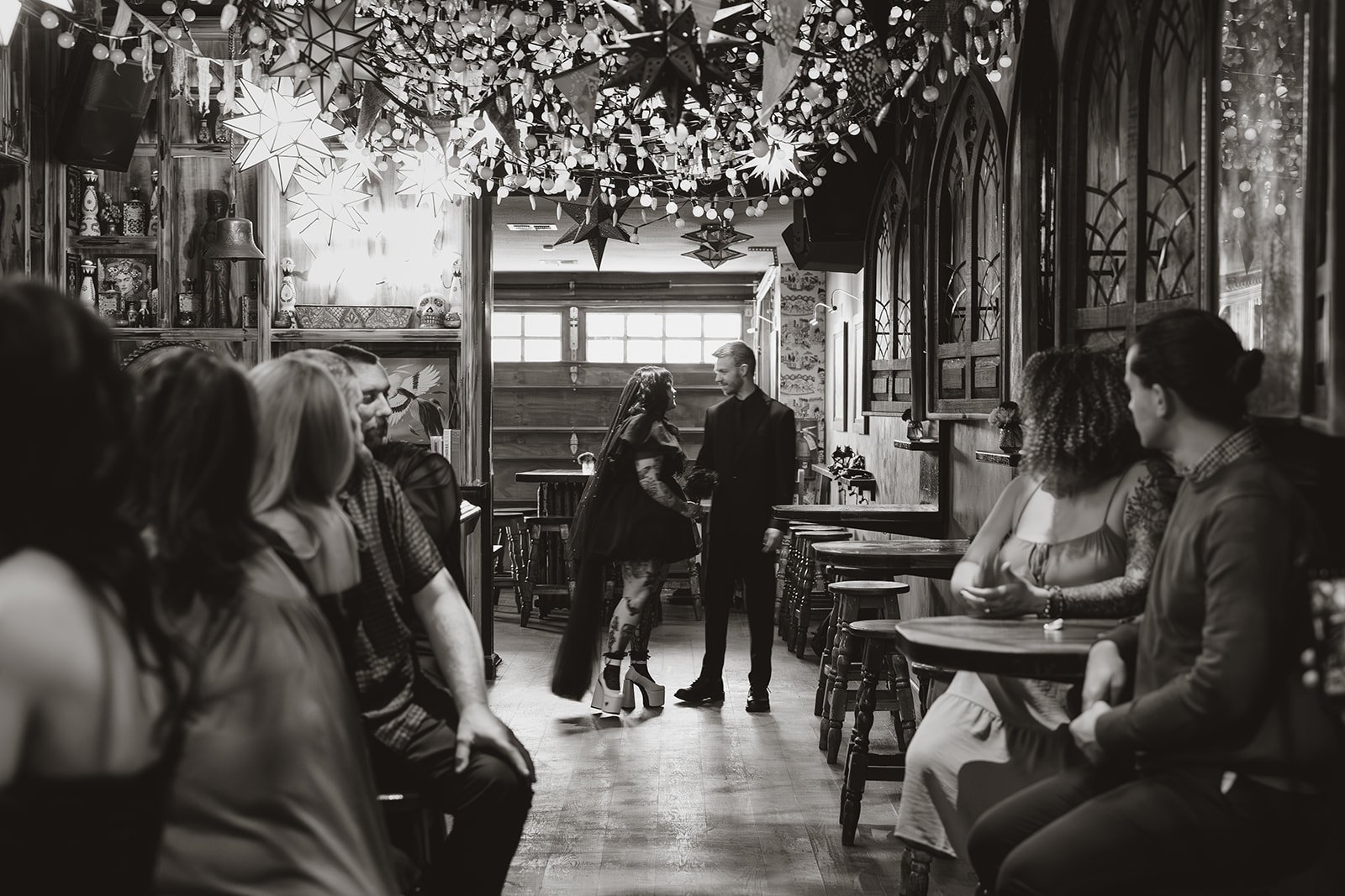 Black and white photo of a couple posing at Lucky Day in Las Vegas.