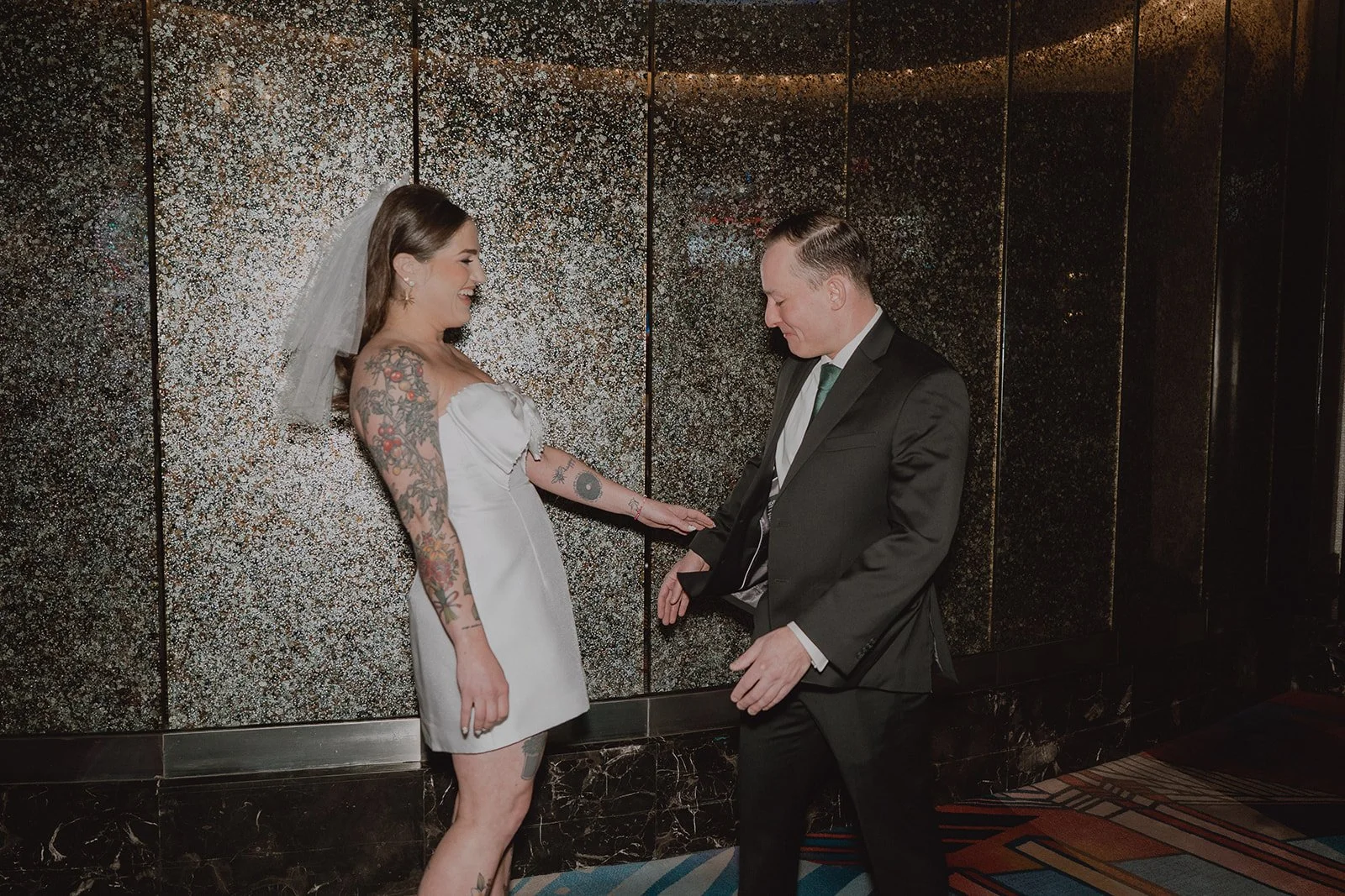 First look between the bride and groom inside New York-New York Hotel & Casino.