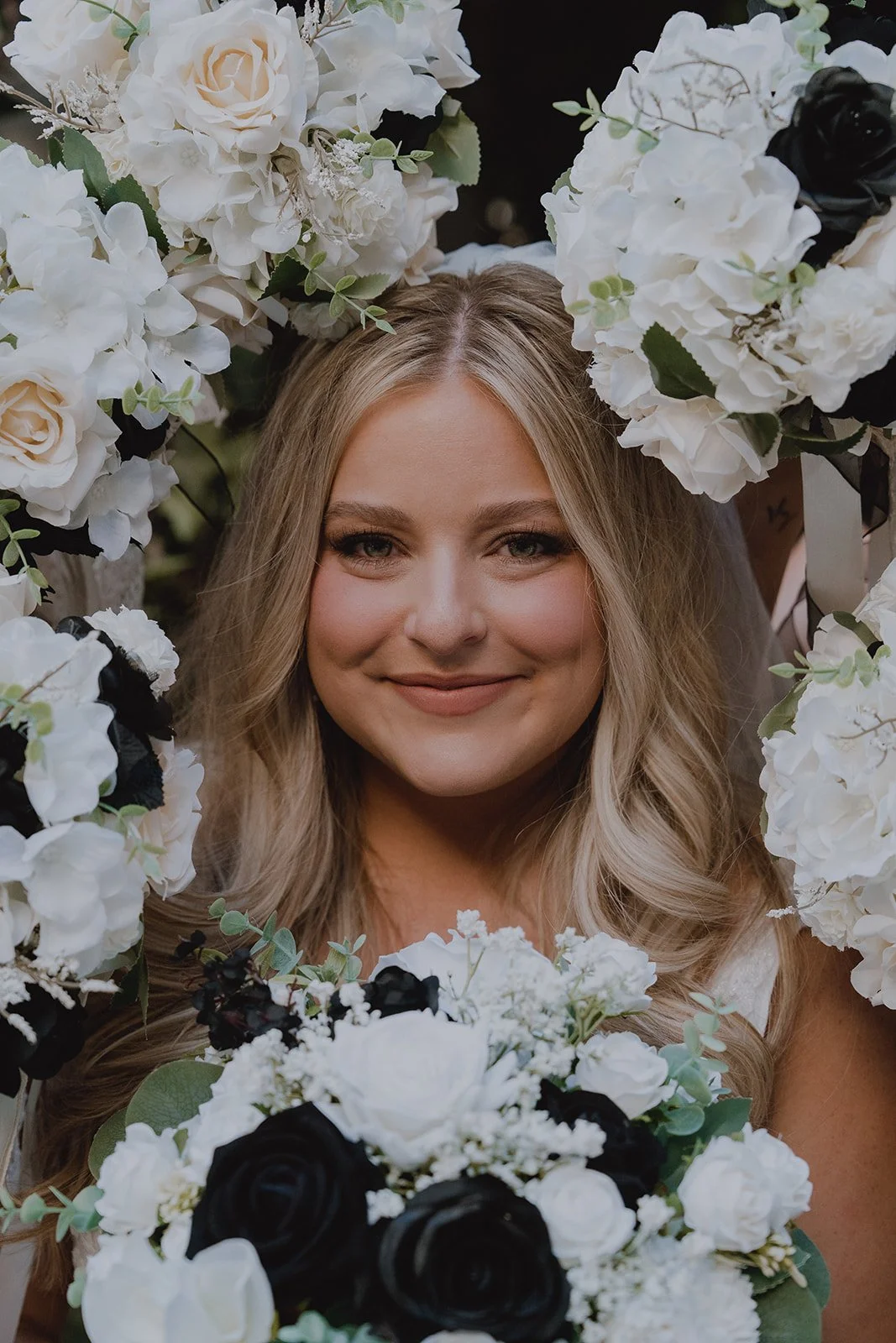 Bride holding a black and white bouquet during portraits at the Venus Garden at Caesars Palace.