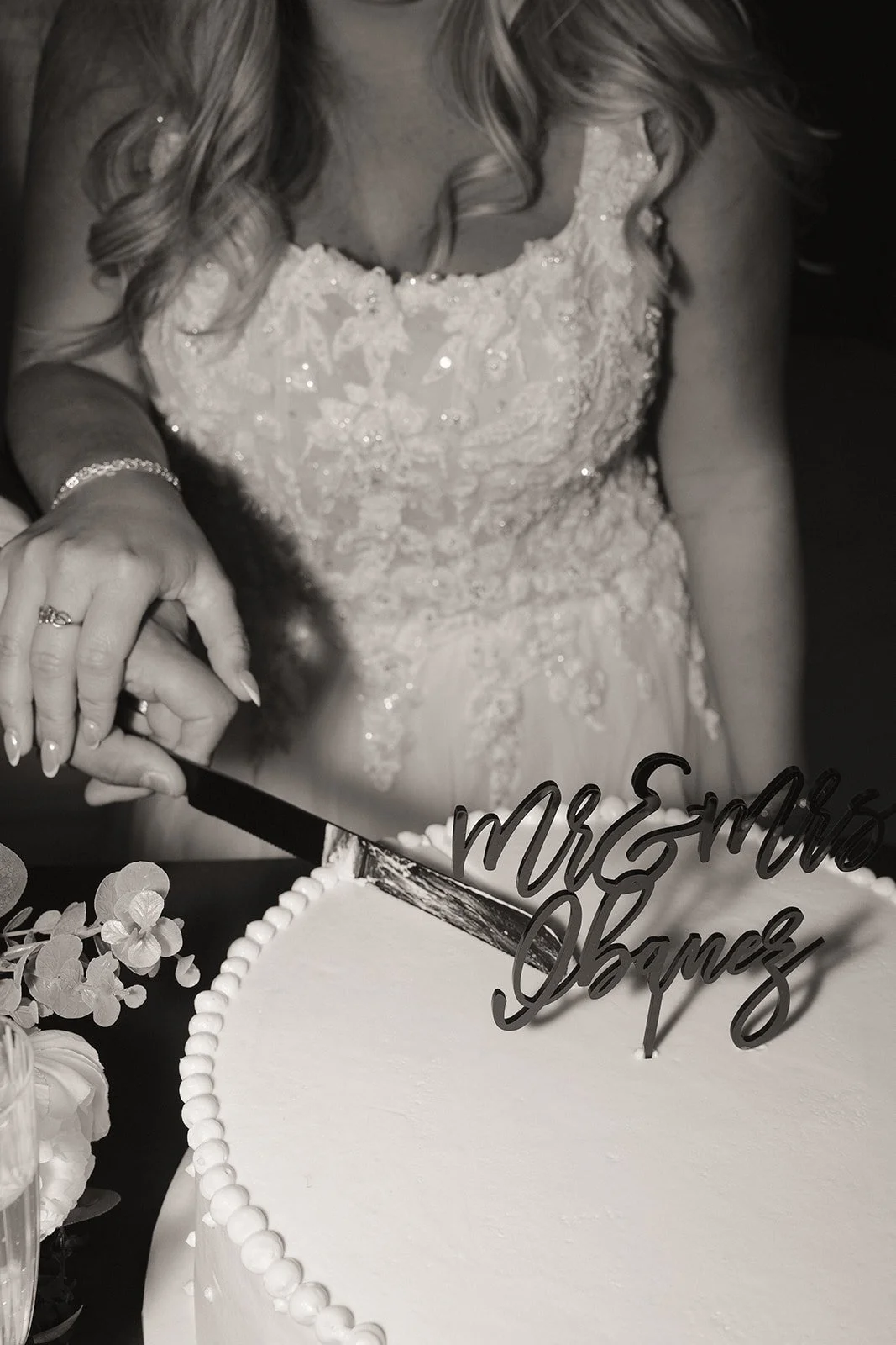 Bride and groom cutting their wedding cake during an intimate micro wedding in Las Vegas at Caesars Palace.