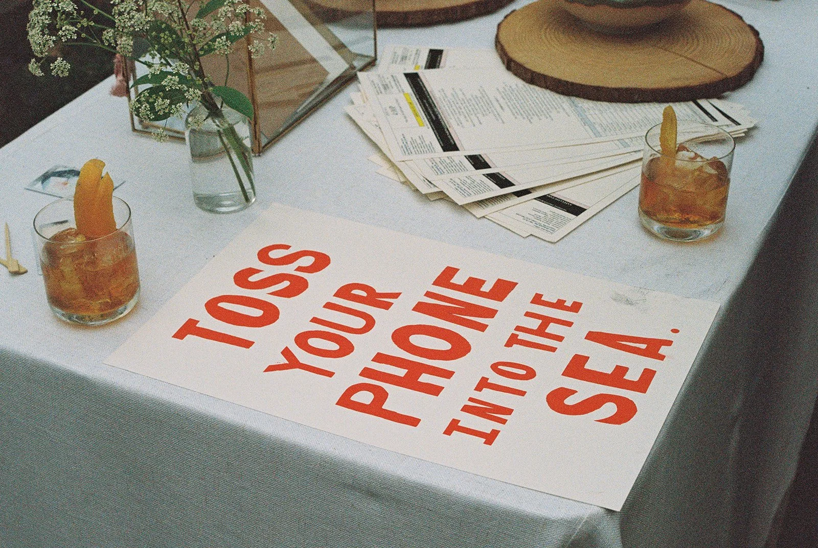 Sign that says toss your phone into the sea.