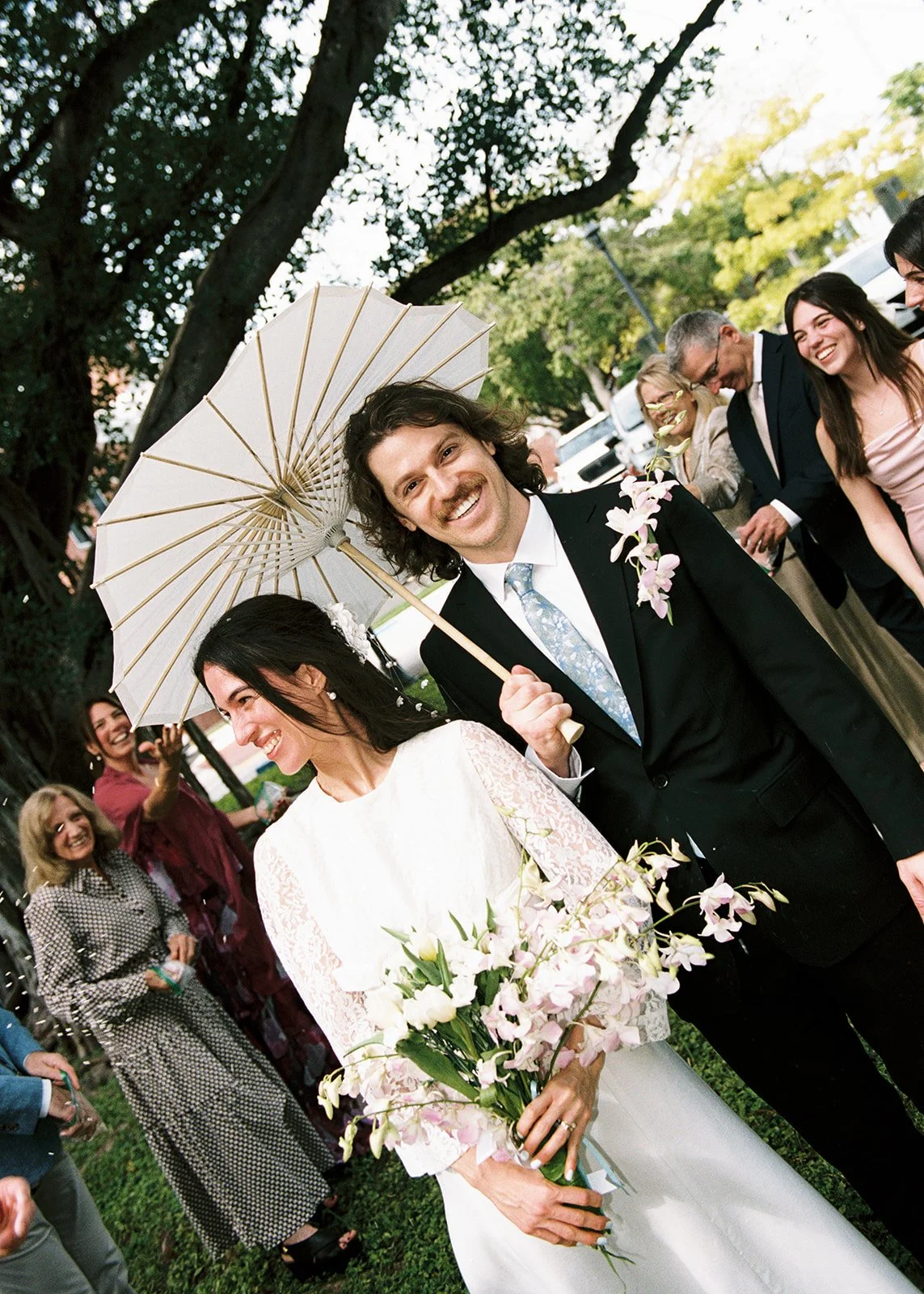 35mm film photo of a couple walking back down the aisle after their Key West Florida elopement