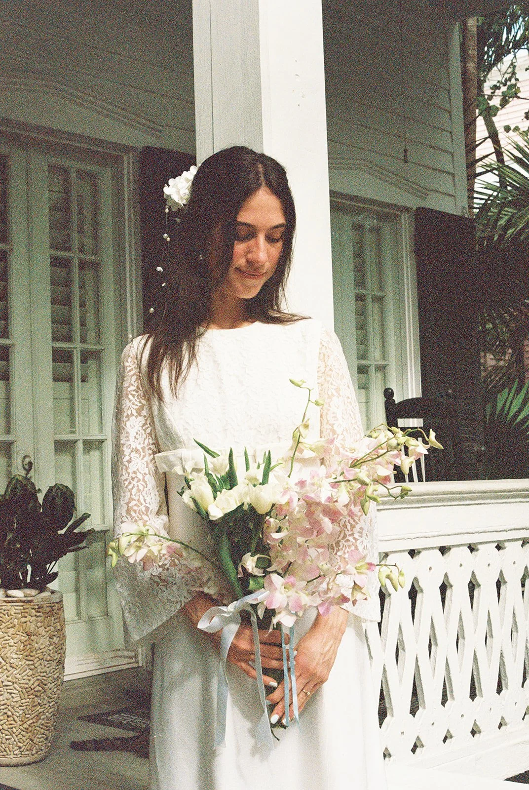 Bride posing in a Saturn Bridal dress.