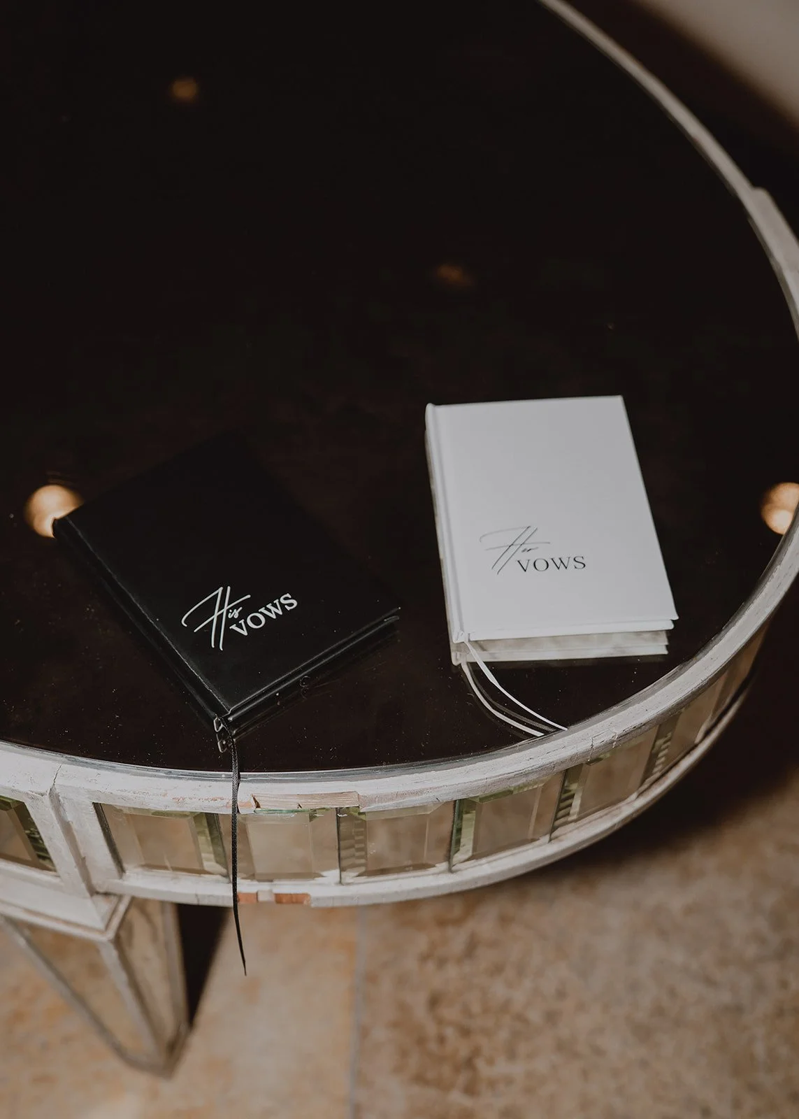 Flat lay of vow books photographed during a Caesars Palace Venus Garden wedding in Las Vegas.