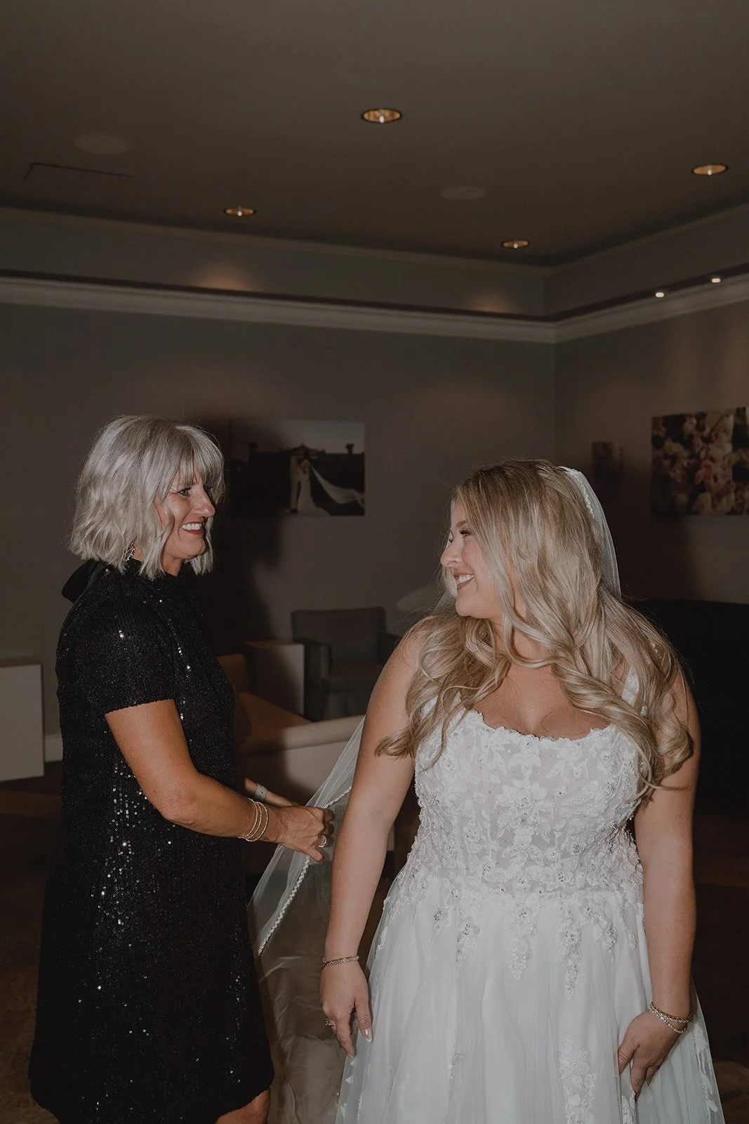 Bride smiling during final getting ready moments inside Caesars Palace before her Venus Garden wedding in Las Vegas.