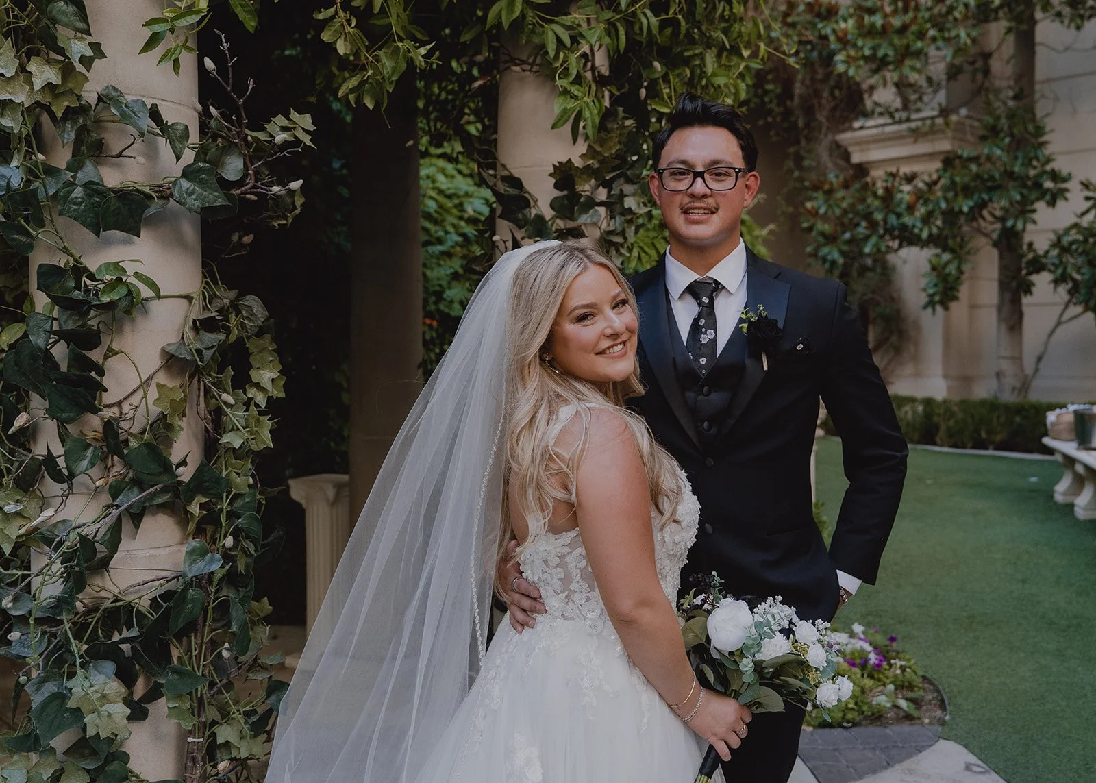 Bride and groom smiling during their Las Vegas micro wedding portraits at Caesars Palace