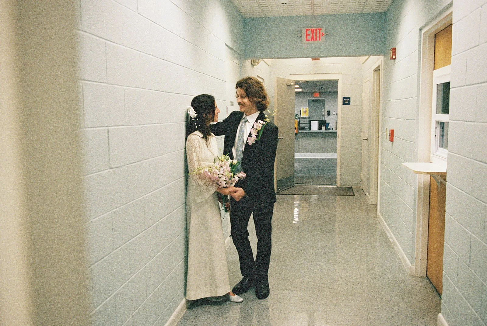 35mm film photo of a couple posing at Monroe County Courthouse in Key West, FL