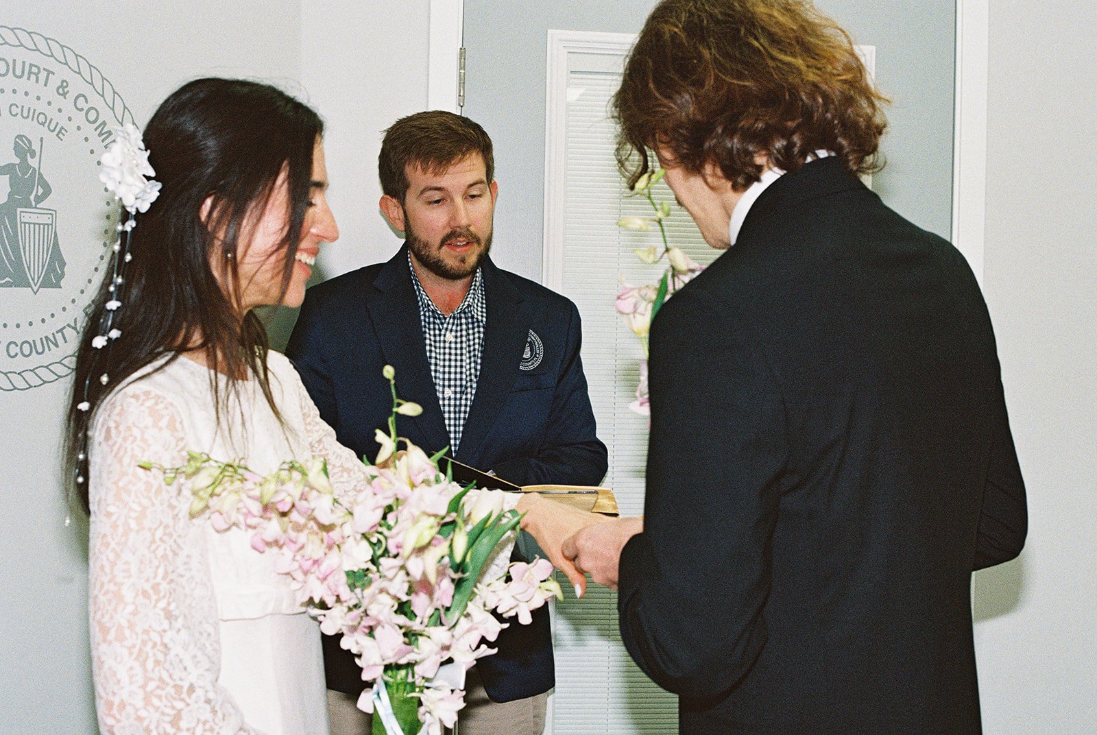Couple exchanging rings during their intimate ceremony at Monroe County Courthouse in Key West, FL
