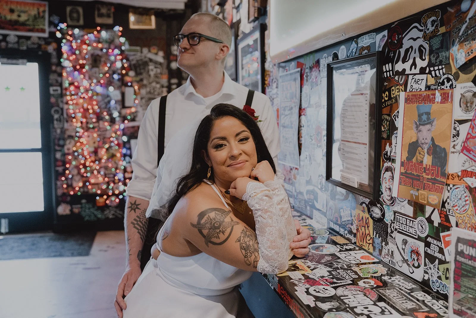 Couple posing inside of The Punk Rock Museum - a unique Las Vegas wedding venue.