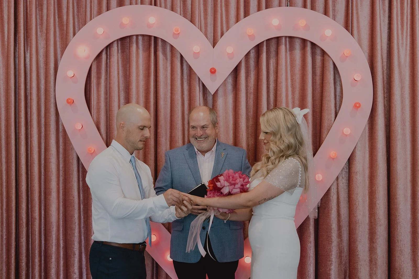 Ring exchange during a Sure Thing Chapel wedding ceremony in Las Vegas.