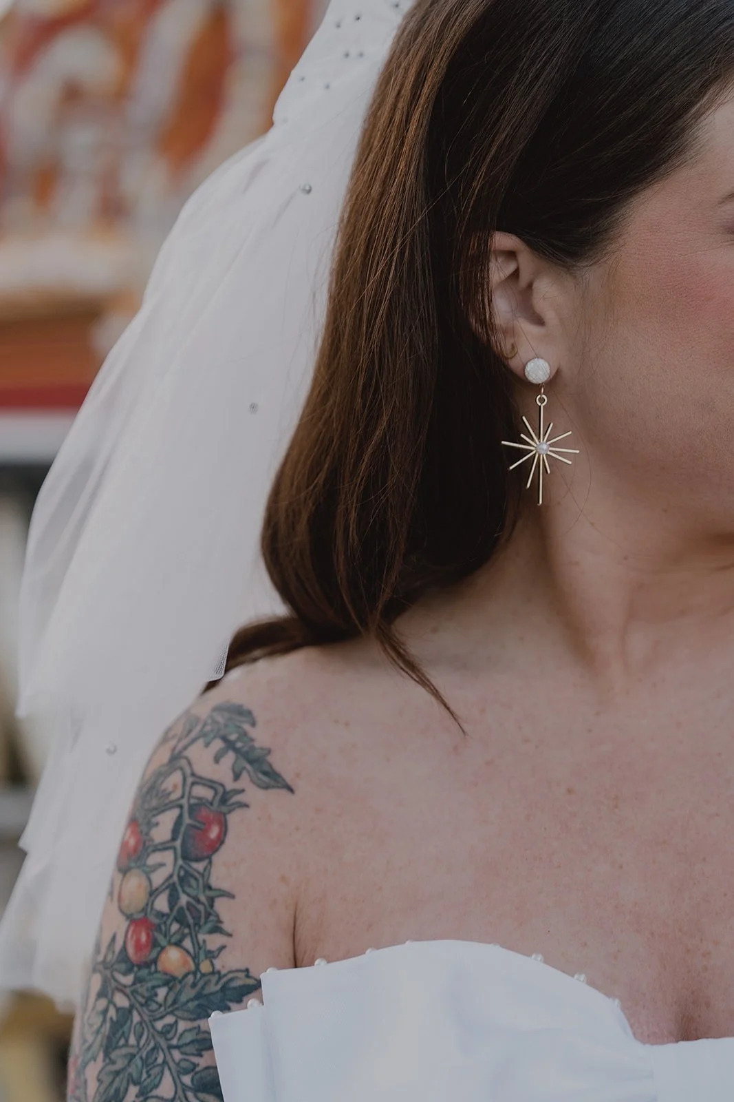 Close up shot of a Las Vegas brides star earrings.