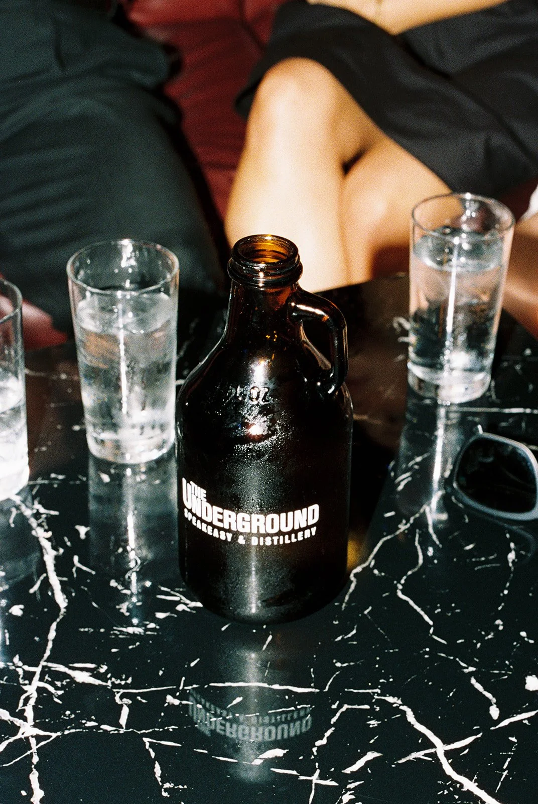 Film photo of guests having drinks from the Underground area at The Mob Museum.