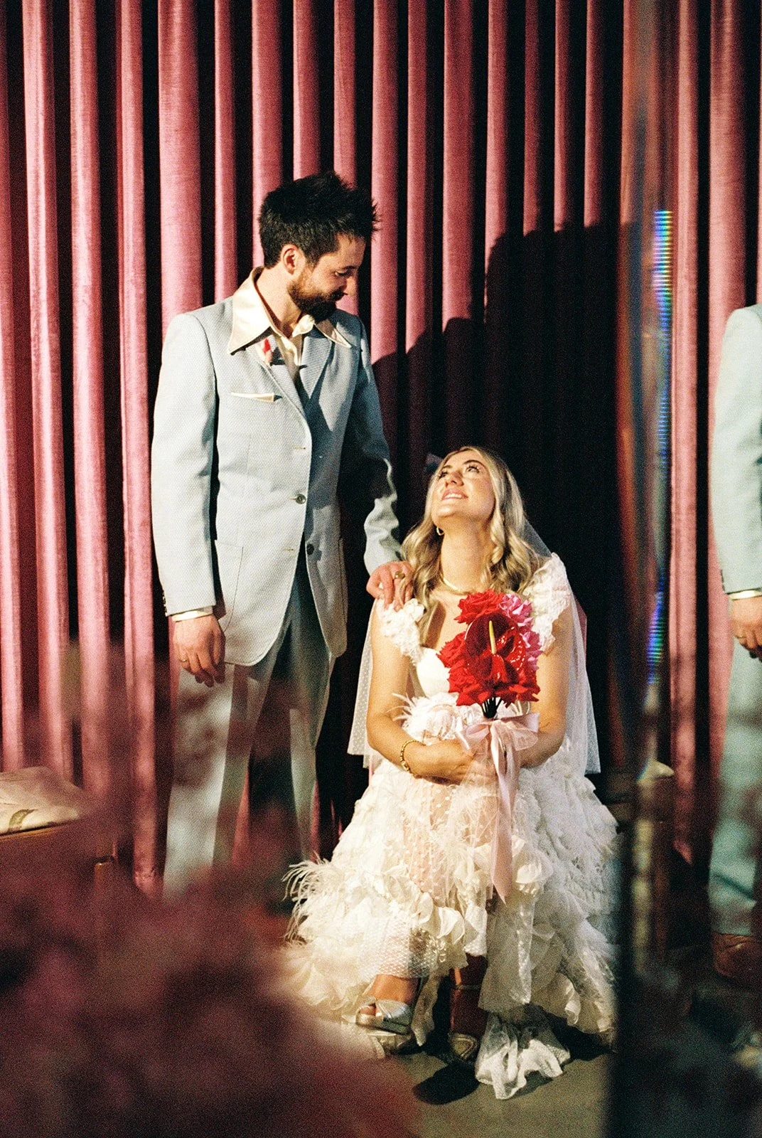 Couple posing for photos at Sure Thing Chapel in Las Vegas on 35mm film.