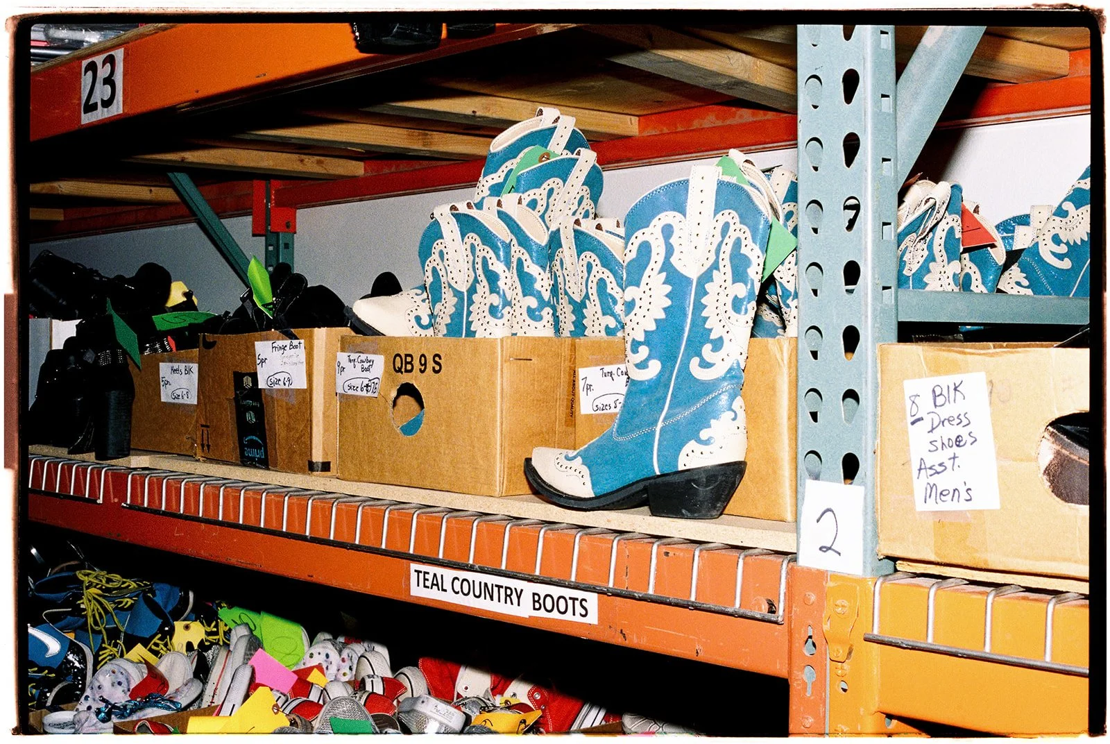 Rows of classic teal showgirl boots stored backstage during the Showgirl Bootcamp Experience in Las Vegas.