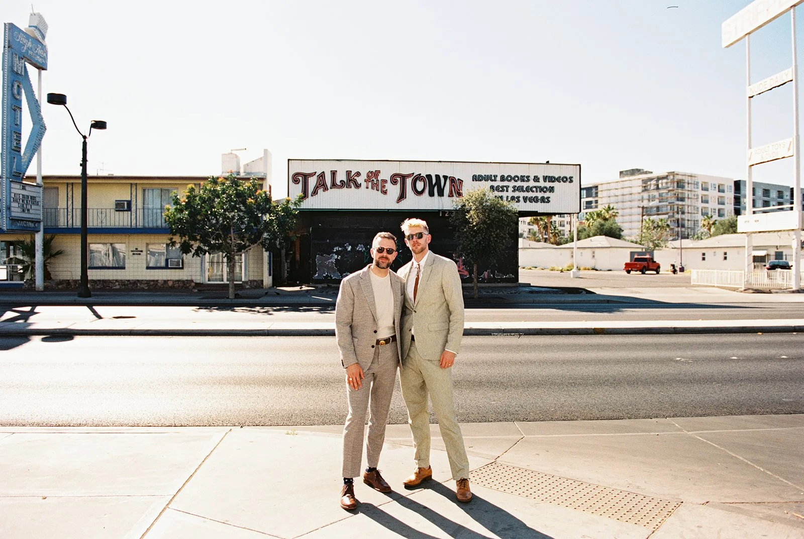 Couple posing in front of Talk of the Town for their Las Vegas elopement photos on 35mm film.