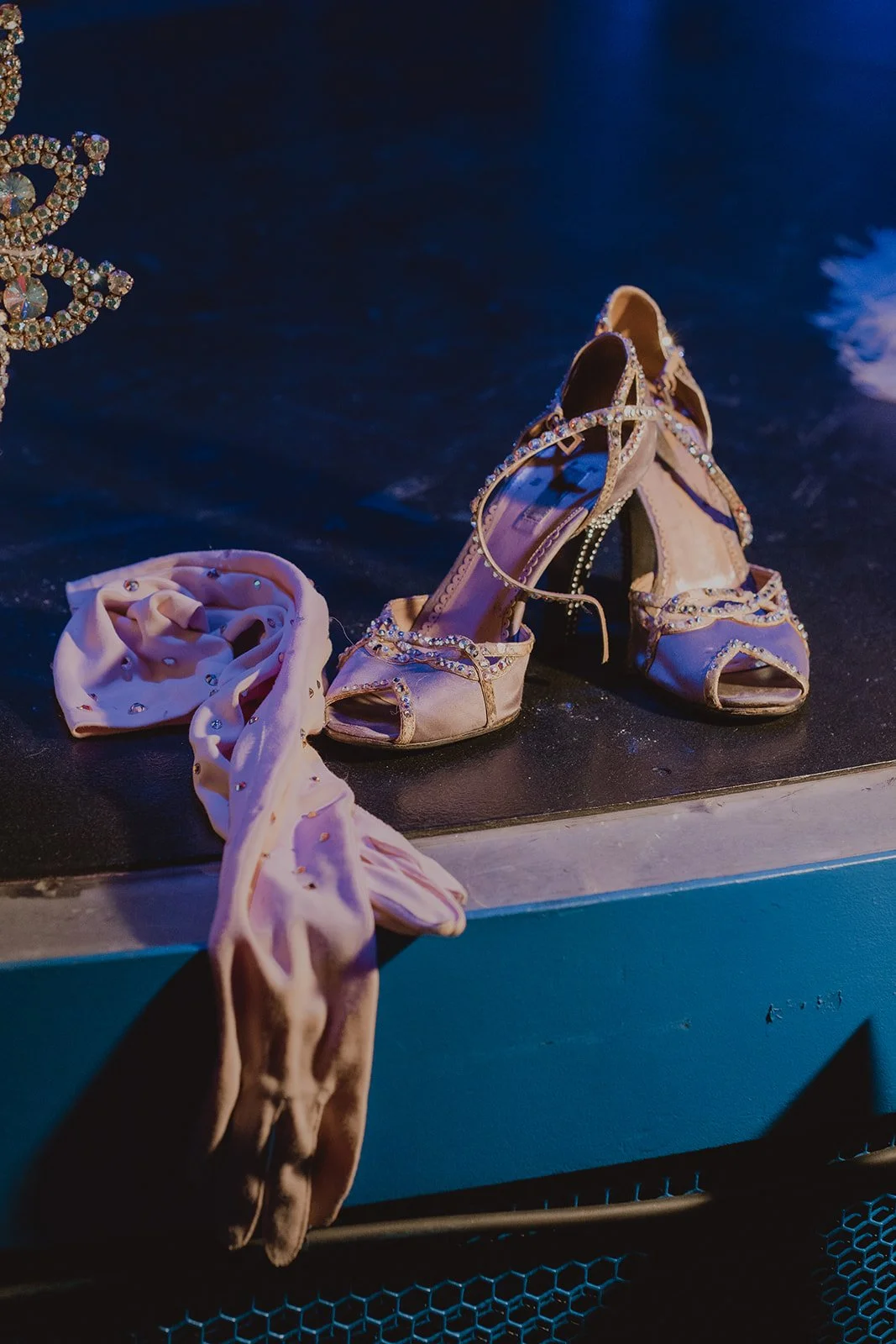 Vintage showgirl heels and gloves staged backstage during the Showgirl Bootcamp Experience, photographed by Cruz Valentin Photography.