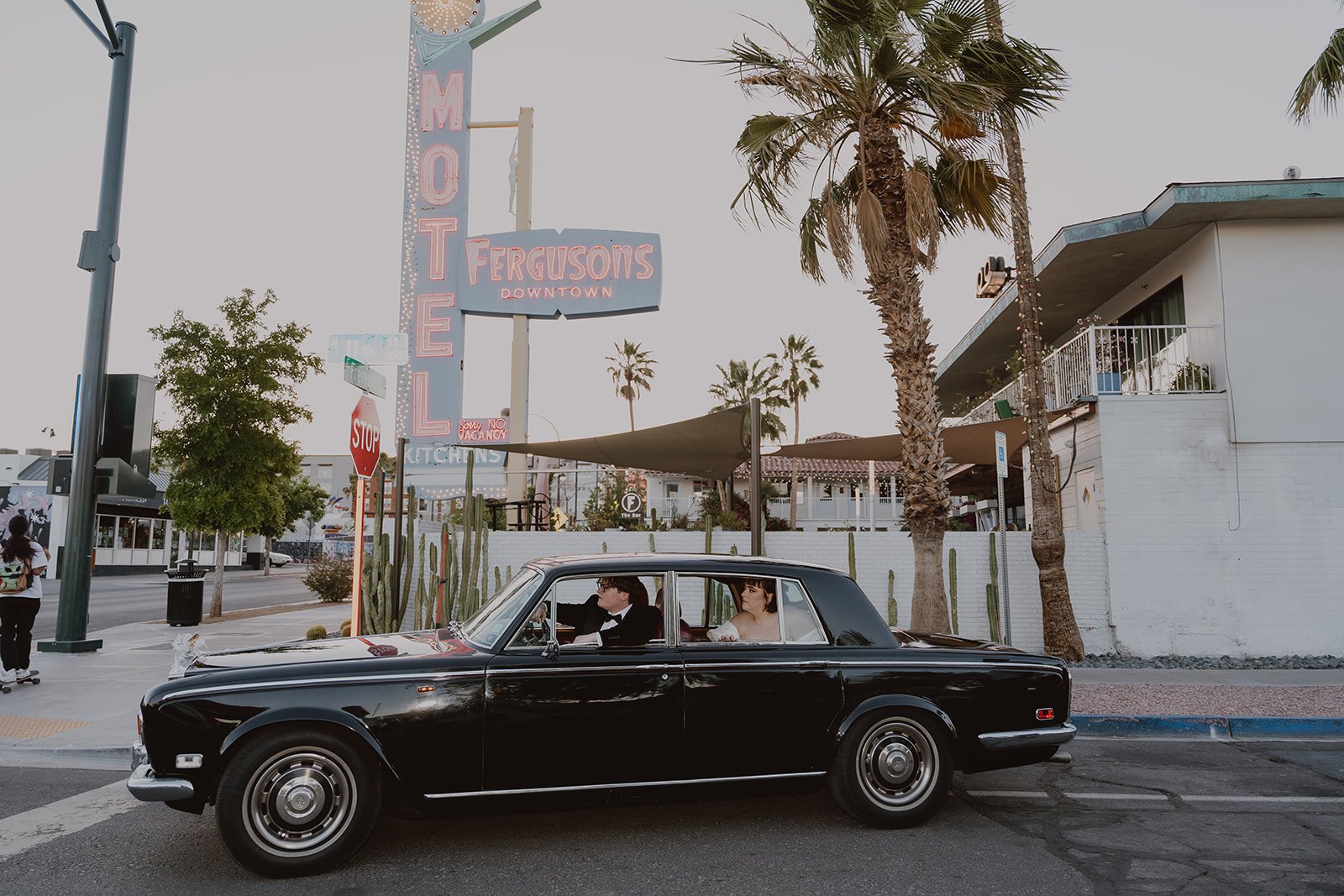 Bride and groom riding around in a classic car from Royal Rides in Las Vegas.