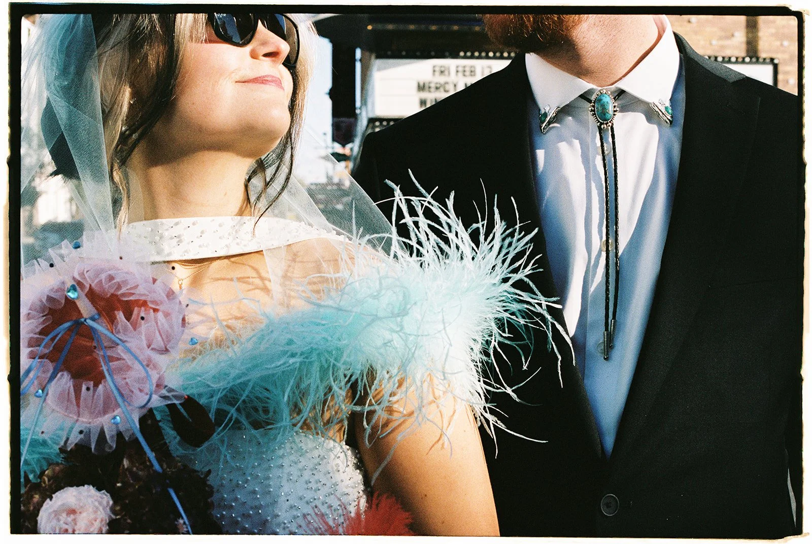 Close up shot of a bride and groom posing for their Las Vegas wedding photos on film.