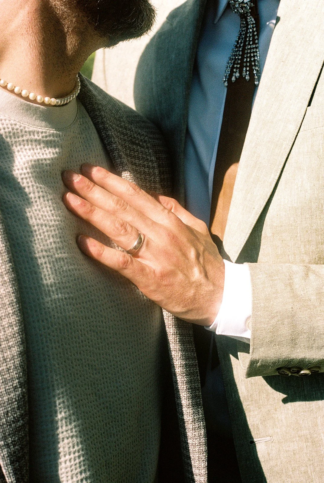 35mm film photo of a couple posing close together.
