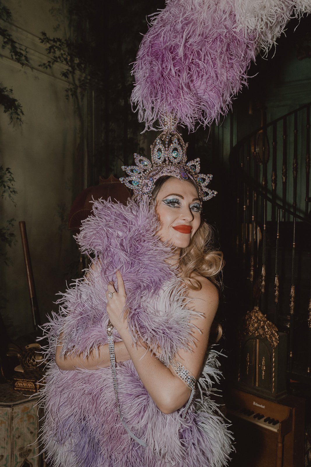Gypsy Wood holding feather her father costume at Superfrico in Las Vegas.