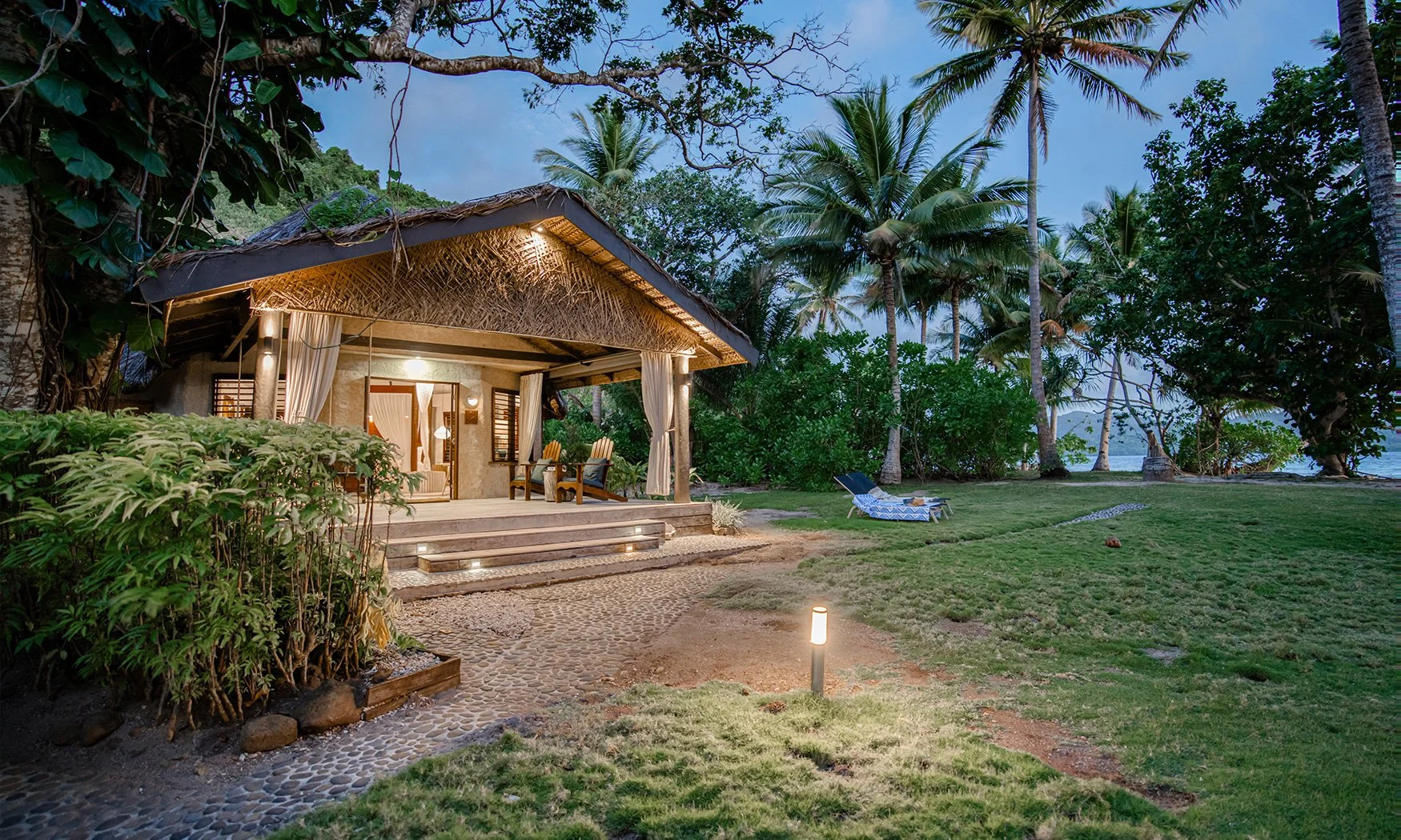 matangi-private-island-accommodation-ocean-view-bure-evening-pathway.jpg