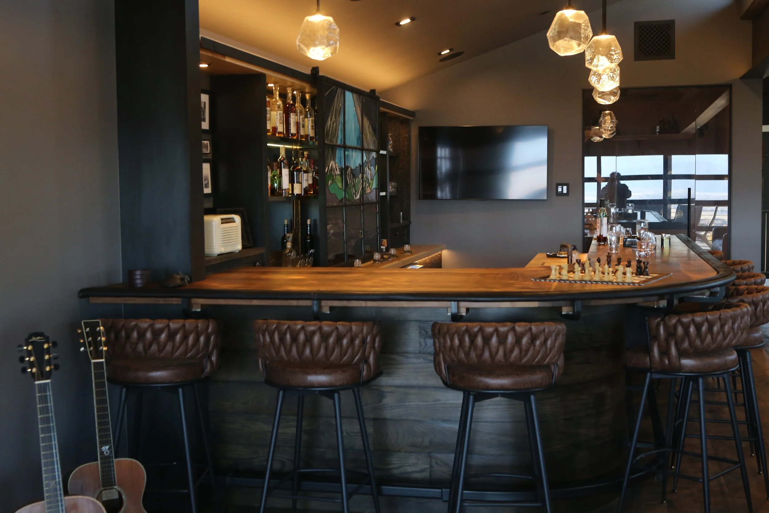 All metal work, foot rest, Arm rest and columns raw steam designed proportionally for this space. To bring out the industrial age of the speakeasy. 