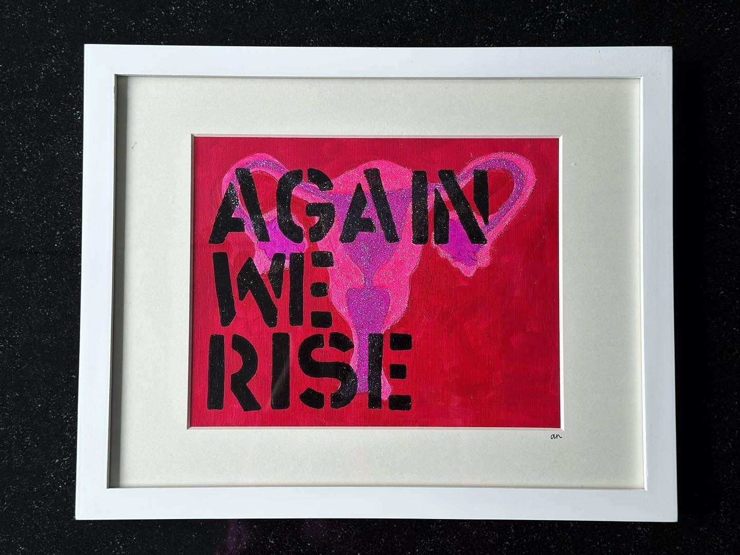 AGAIN WE RISE