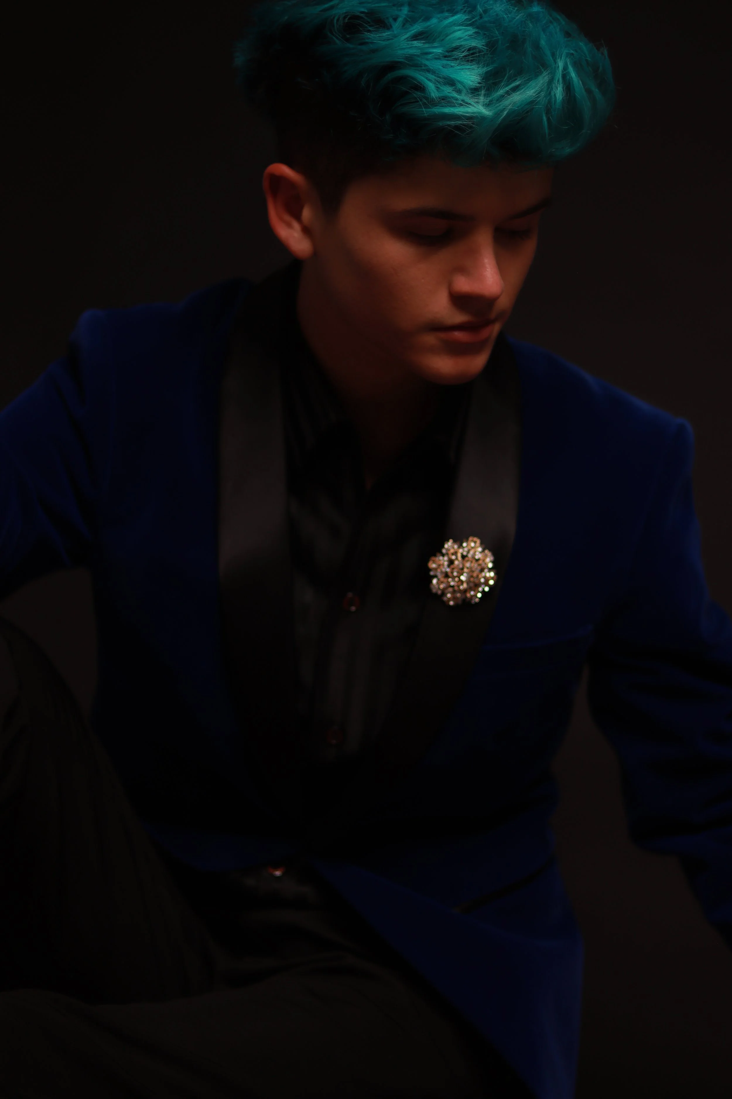 Day Mori, Los Angeles magician and mentalist, in a blue velvet suit