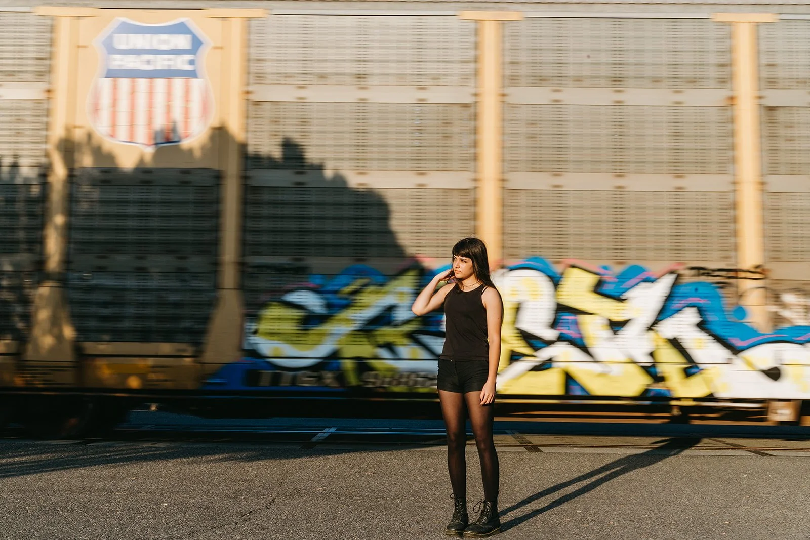 bold-senior-portrait-train-graffiti-motion-blur-portland-oregon.jpg
