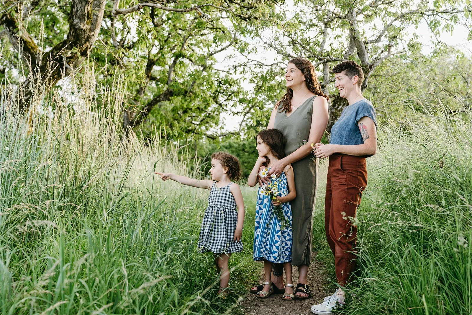 authentic-lgbtq-family-photo-daughters-moms-park-wildflowers-portland-oregon.jpg