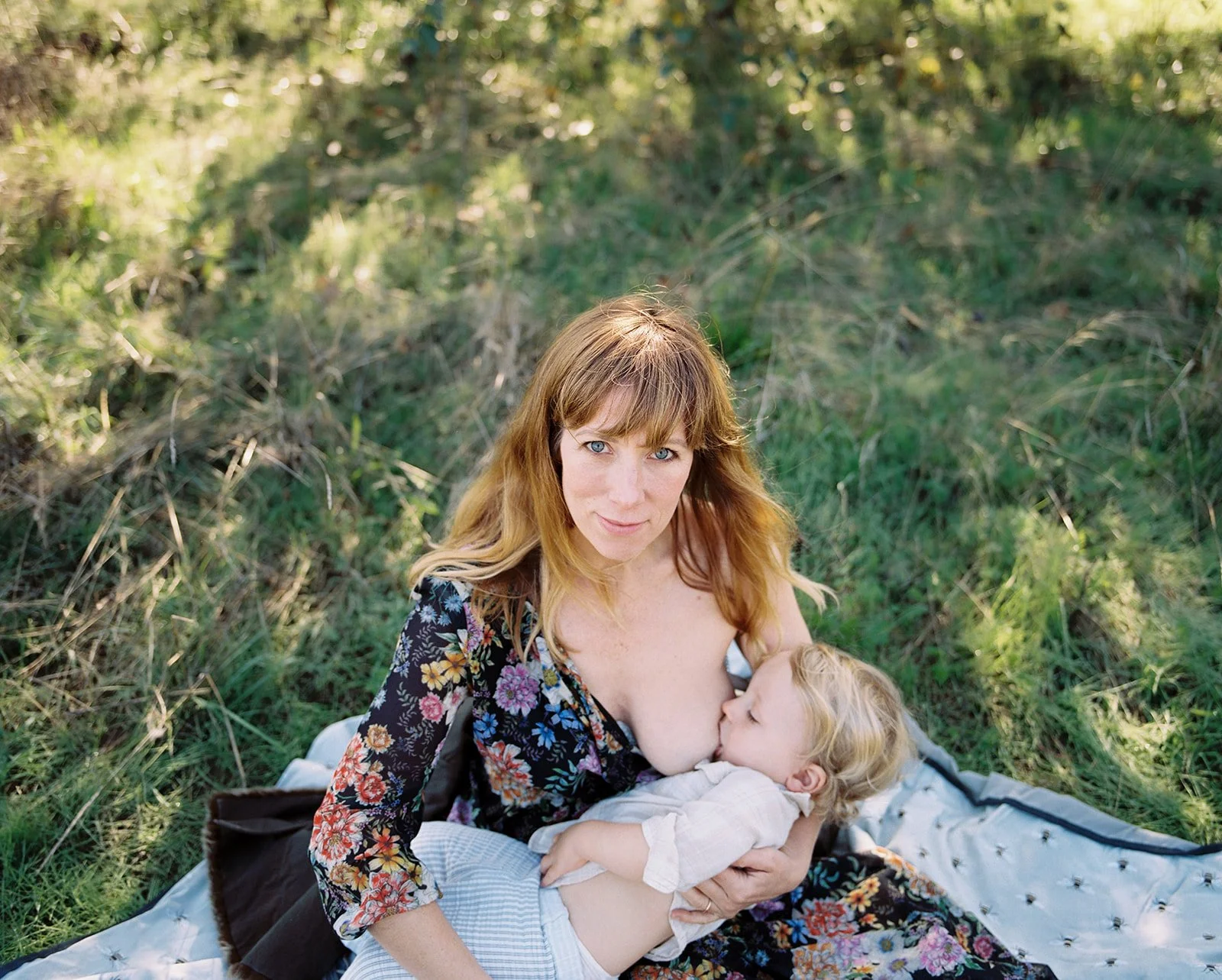 mother-baby-nursing-field-light-film-lifestyle-portrait-portland-oregon.jpg