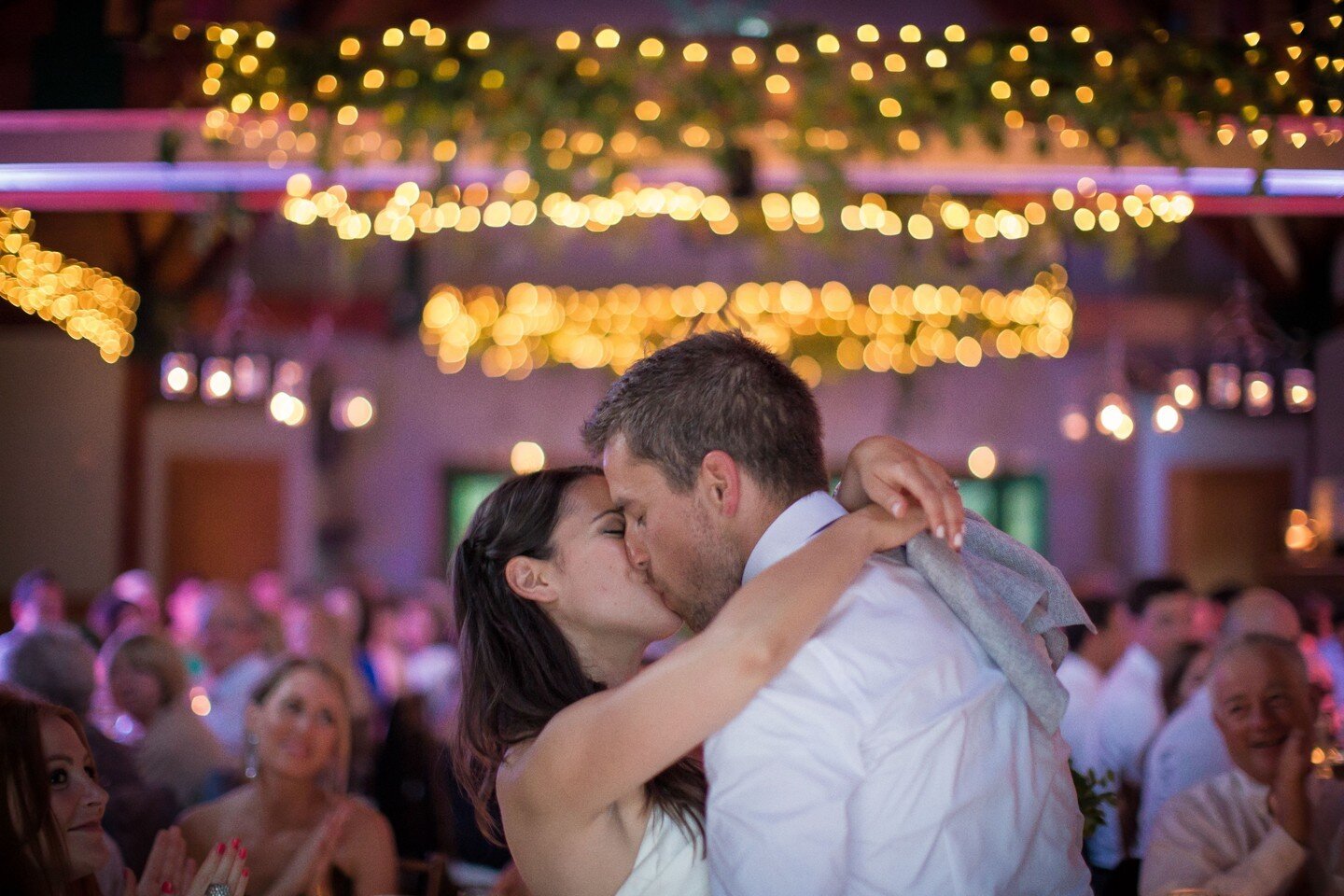 Go ahead and make a scene. We'll take advantage of that lovely bokeh. And the composition. Aall you have to do is gave fun. #weddingkiss #kiss #reception #bokeh #weddinglighting #weddingreception #kissing #destinationweddings #destinationwedding #tra