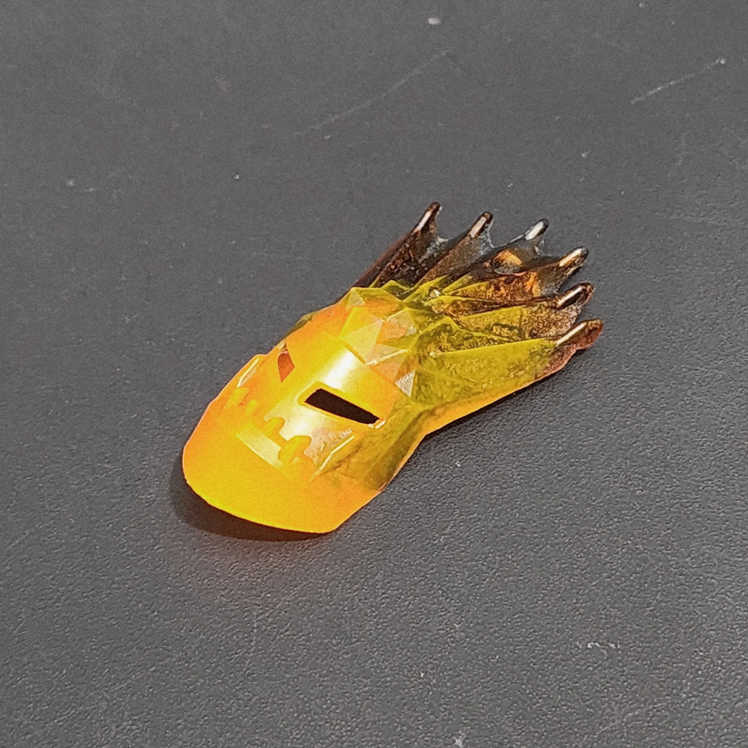 Milky neon orange and metallic straak mask