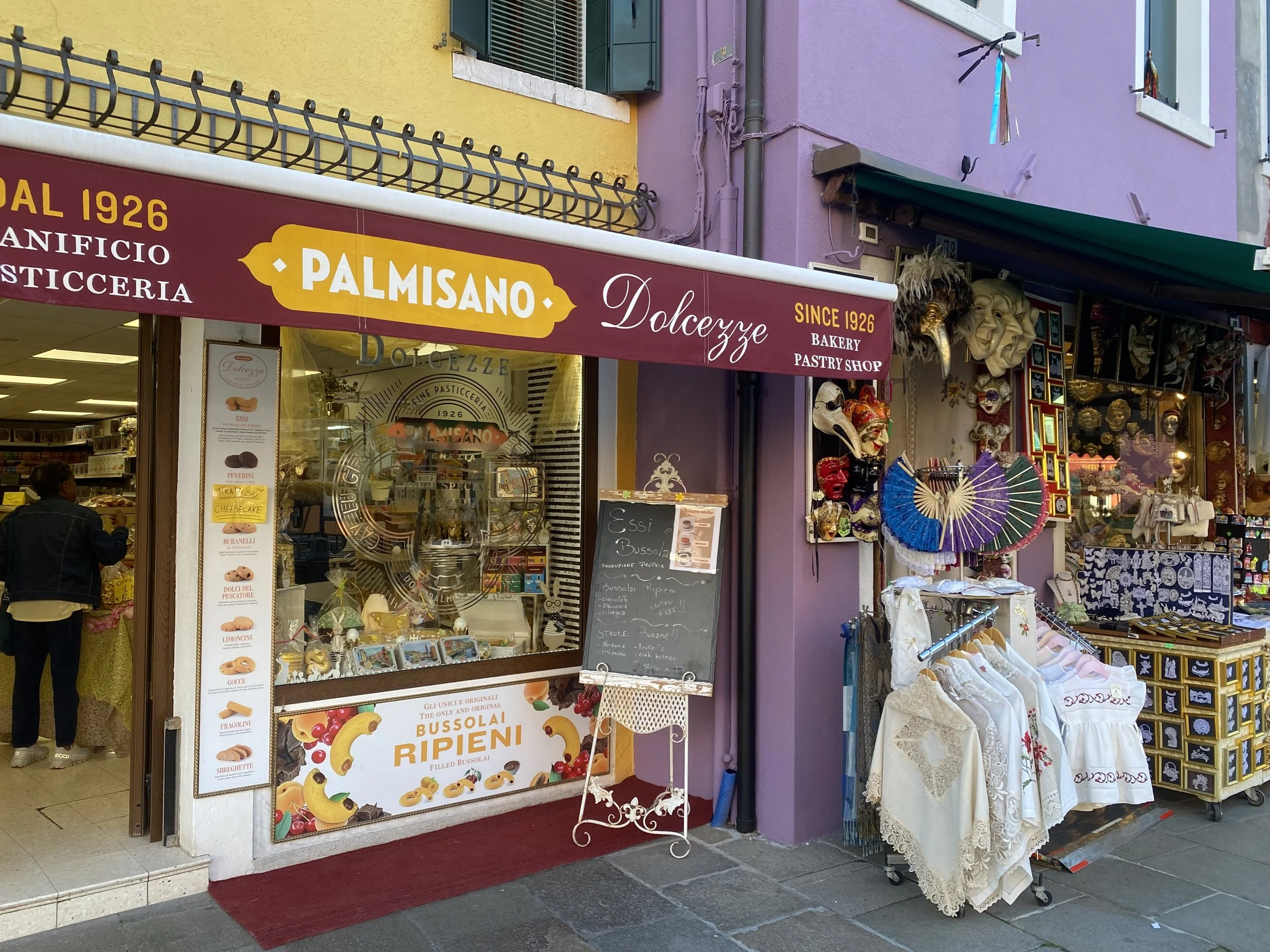 Pastries next to a Textile shop