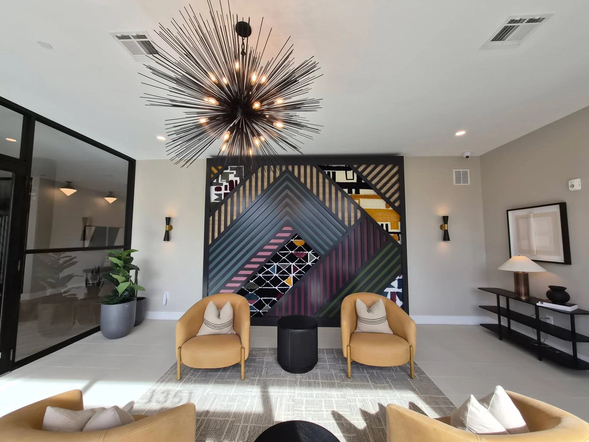 A #focalwall months in the making...

This floor to ceiling focal wall was a dream come true to work on for this #multifamily project.

I hand-wove all four textile sections, all inspired by Ruth Adler's textile designs (the namesake for this #multif