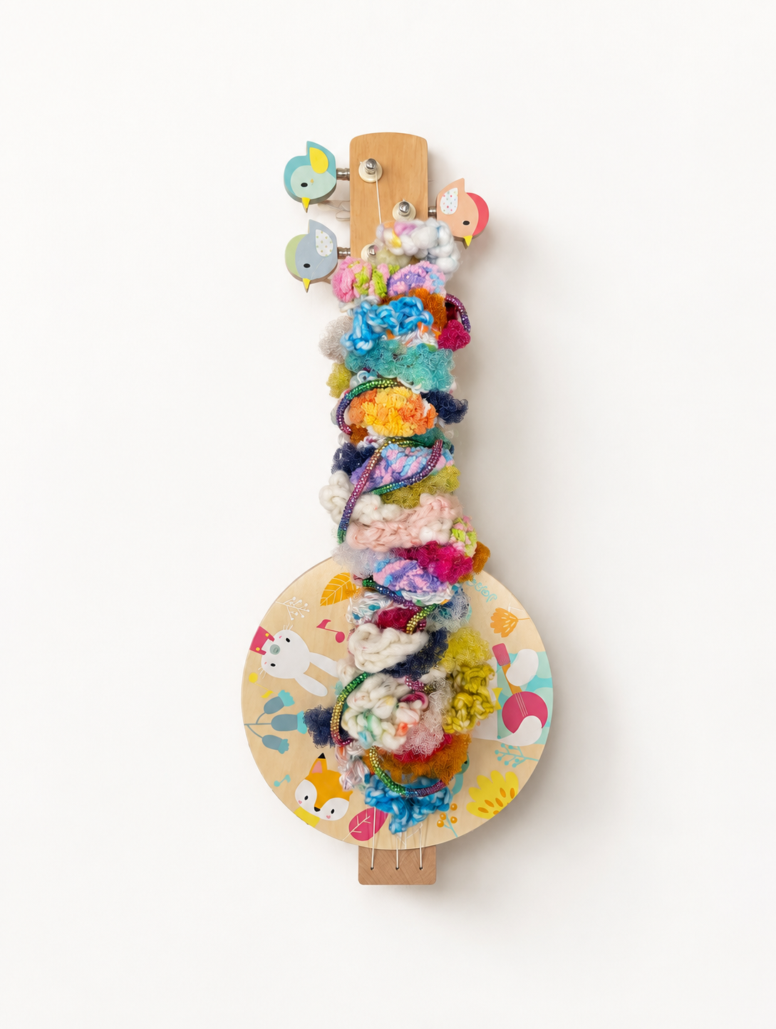 A composition of interwoven fibers set within the strings of a banjo