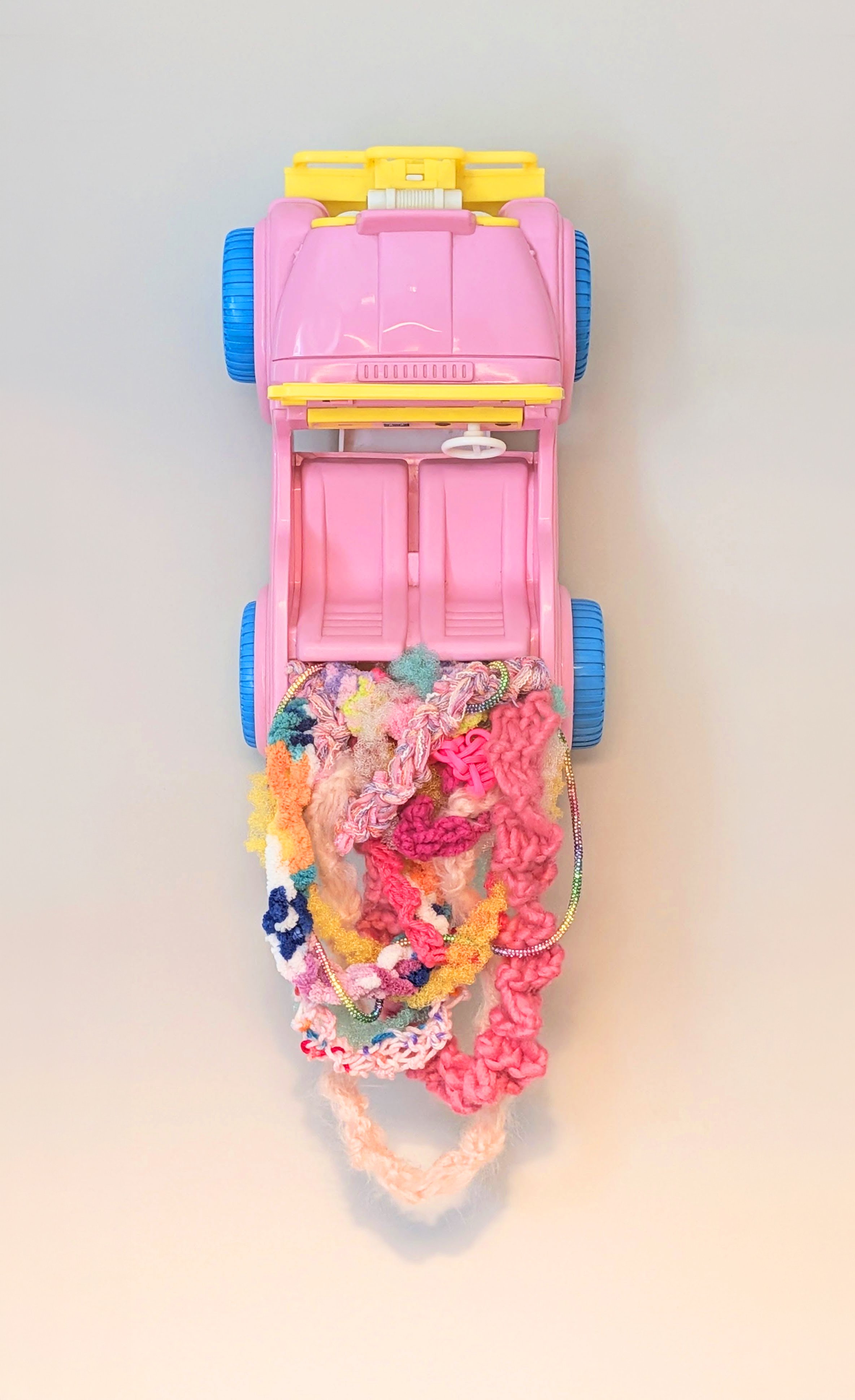 composition of interwoven fibers set within a 1987 Barbie Jeep