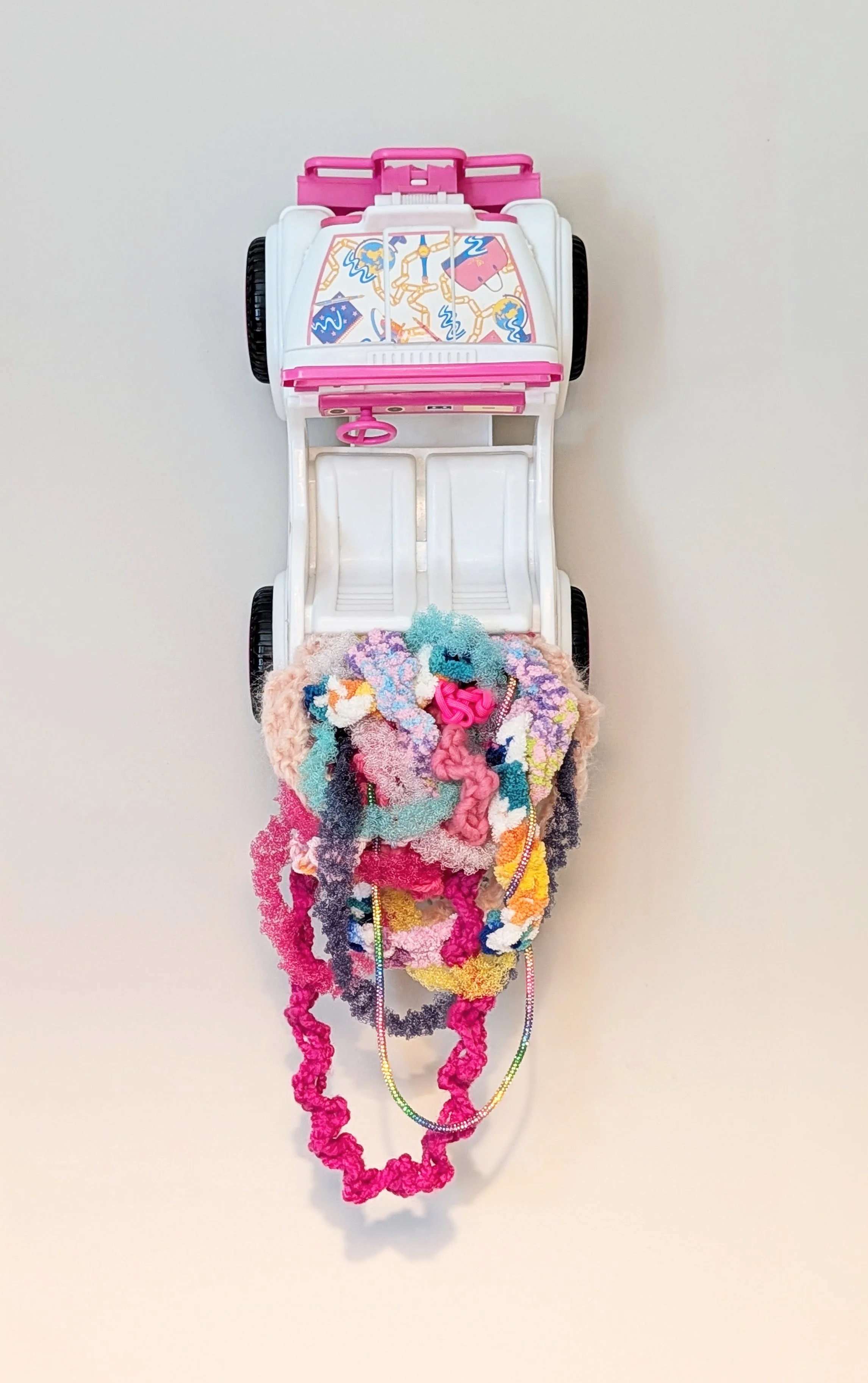composition of interwoven fibers set within a 1987 Barbie Jeep