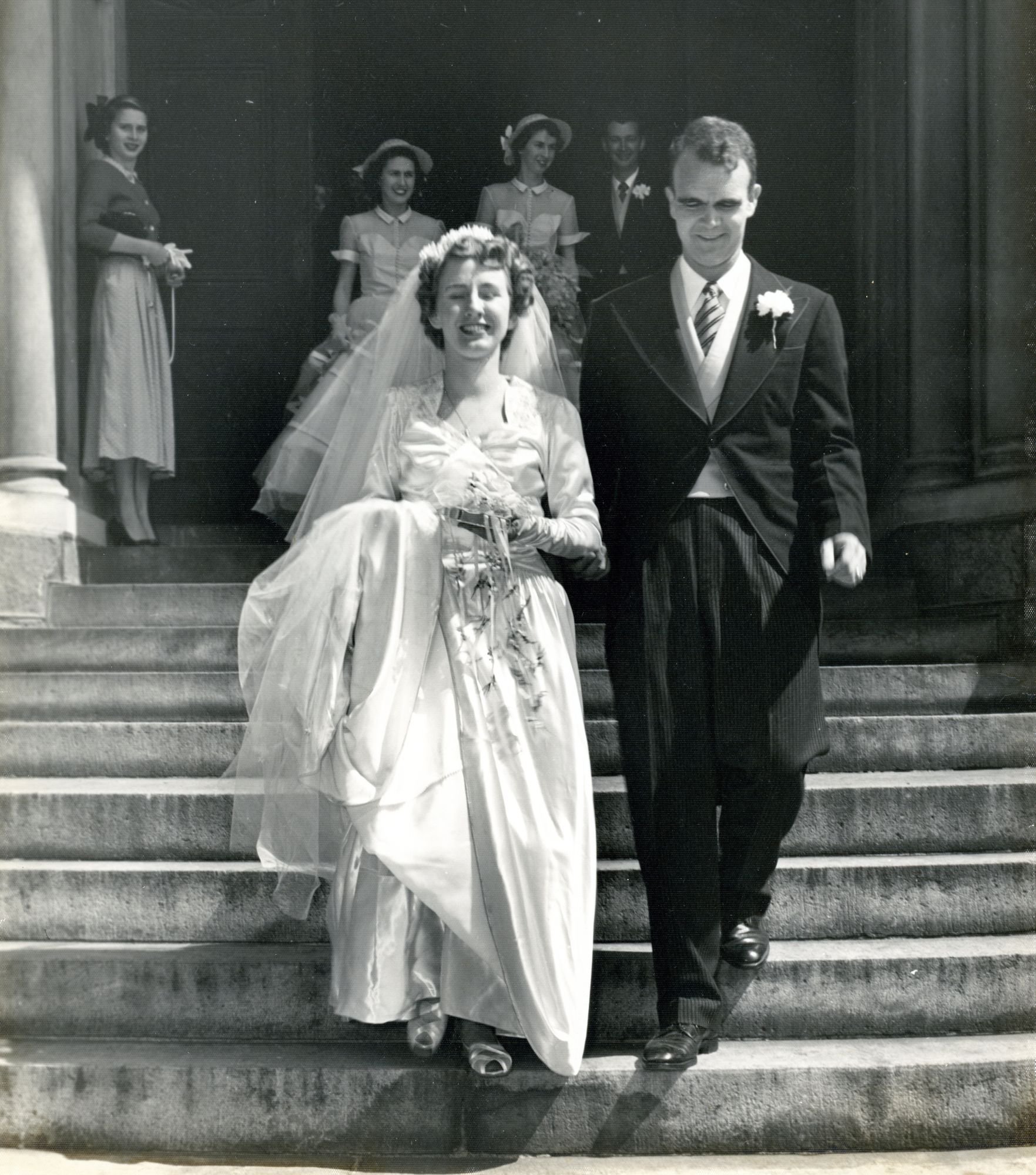 Mary Annette Van Sant and Thomas Ellis Wheeler walking down the front steps of Sacred Heart Catholic Church, Augusta, Georgia, 1950
