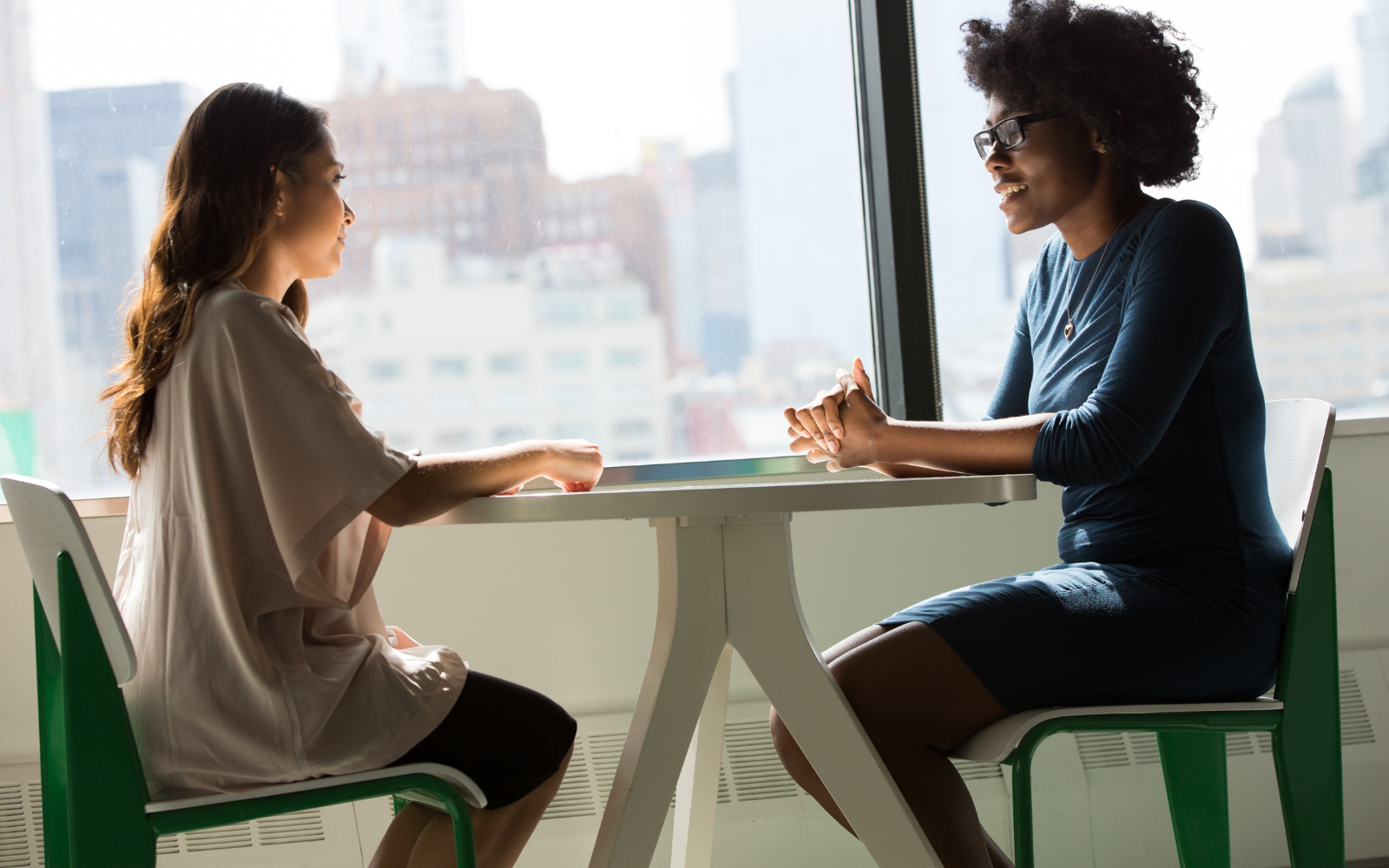 Two women having a supportive one-on-one conversation