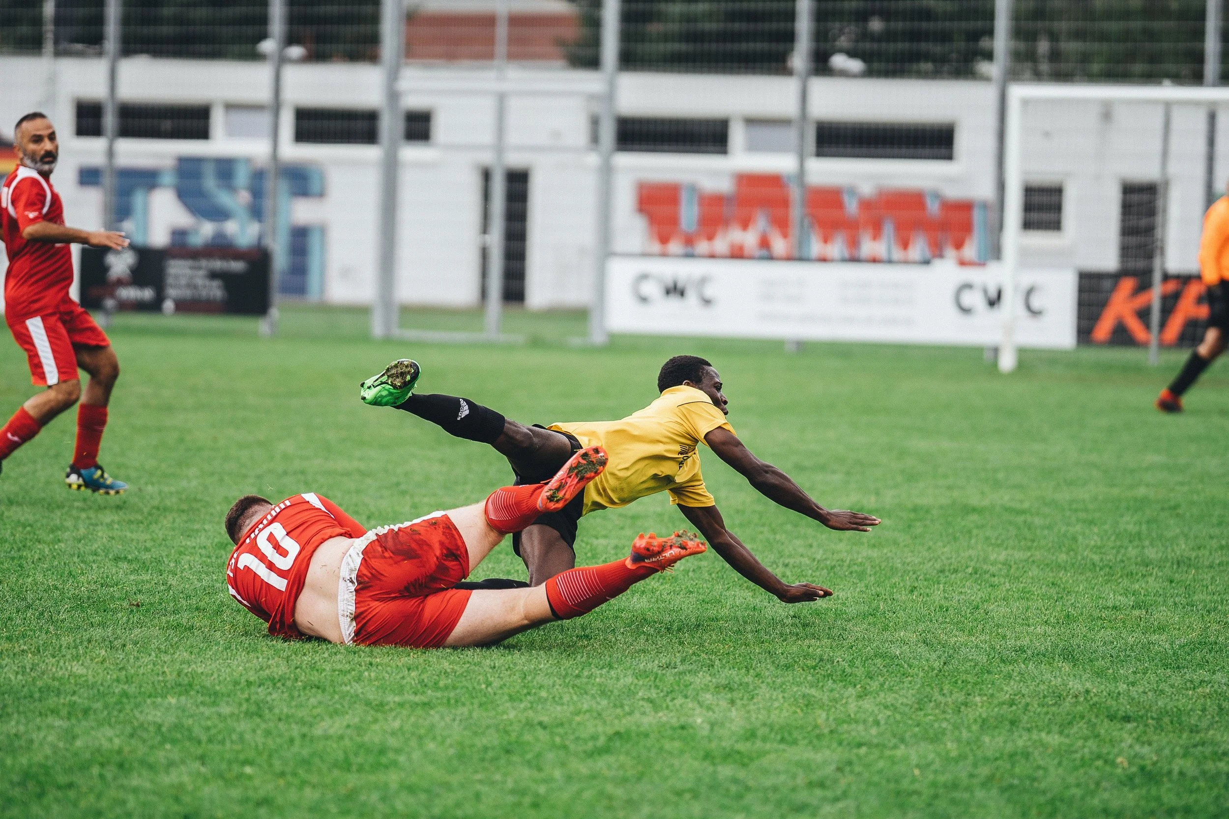 Soccer players colliding during a game