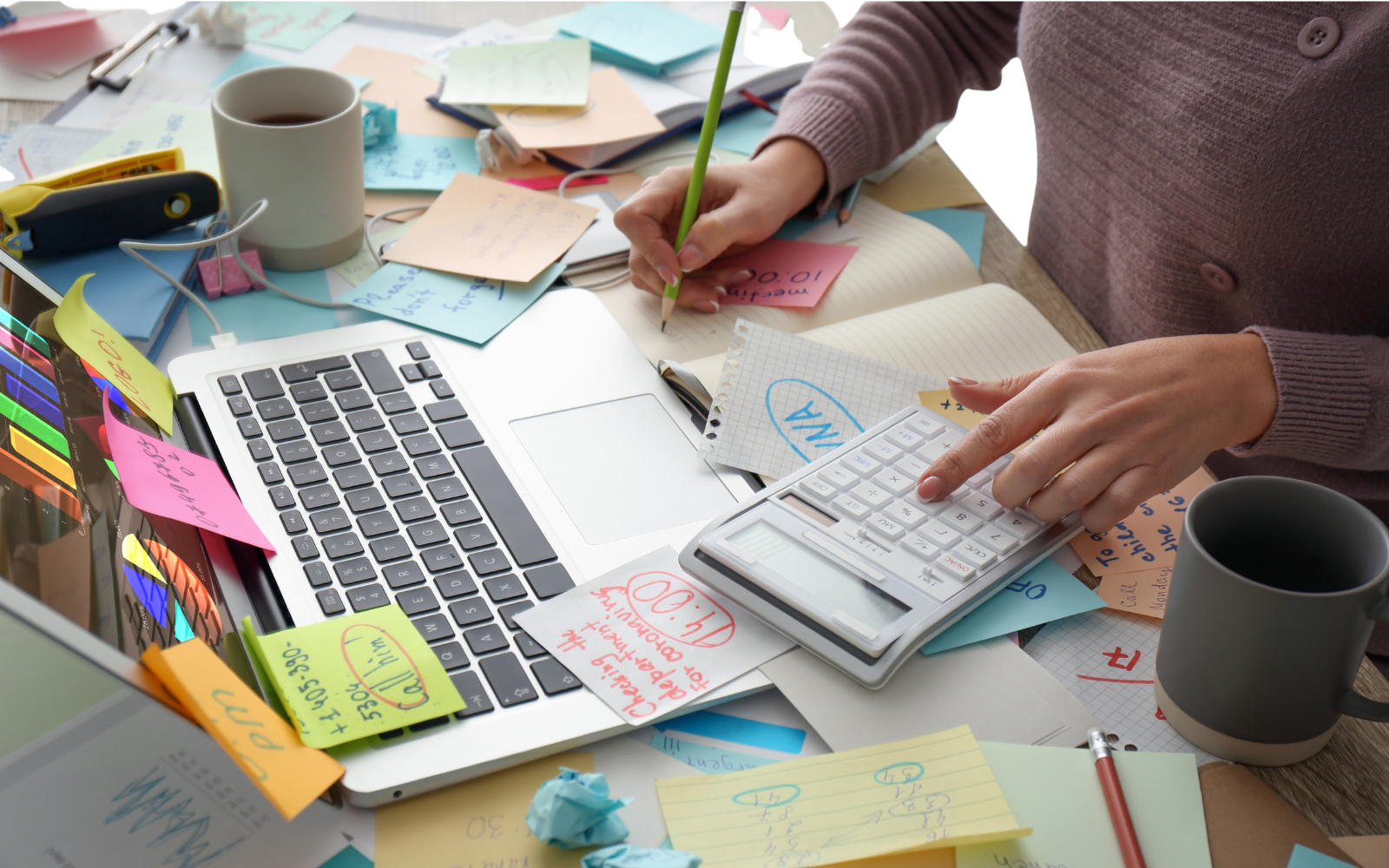 Cluttered desk with sticky notes representing ADHD-related task overwhelm